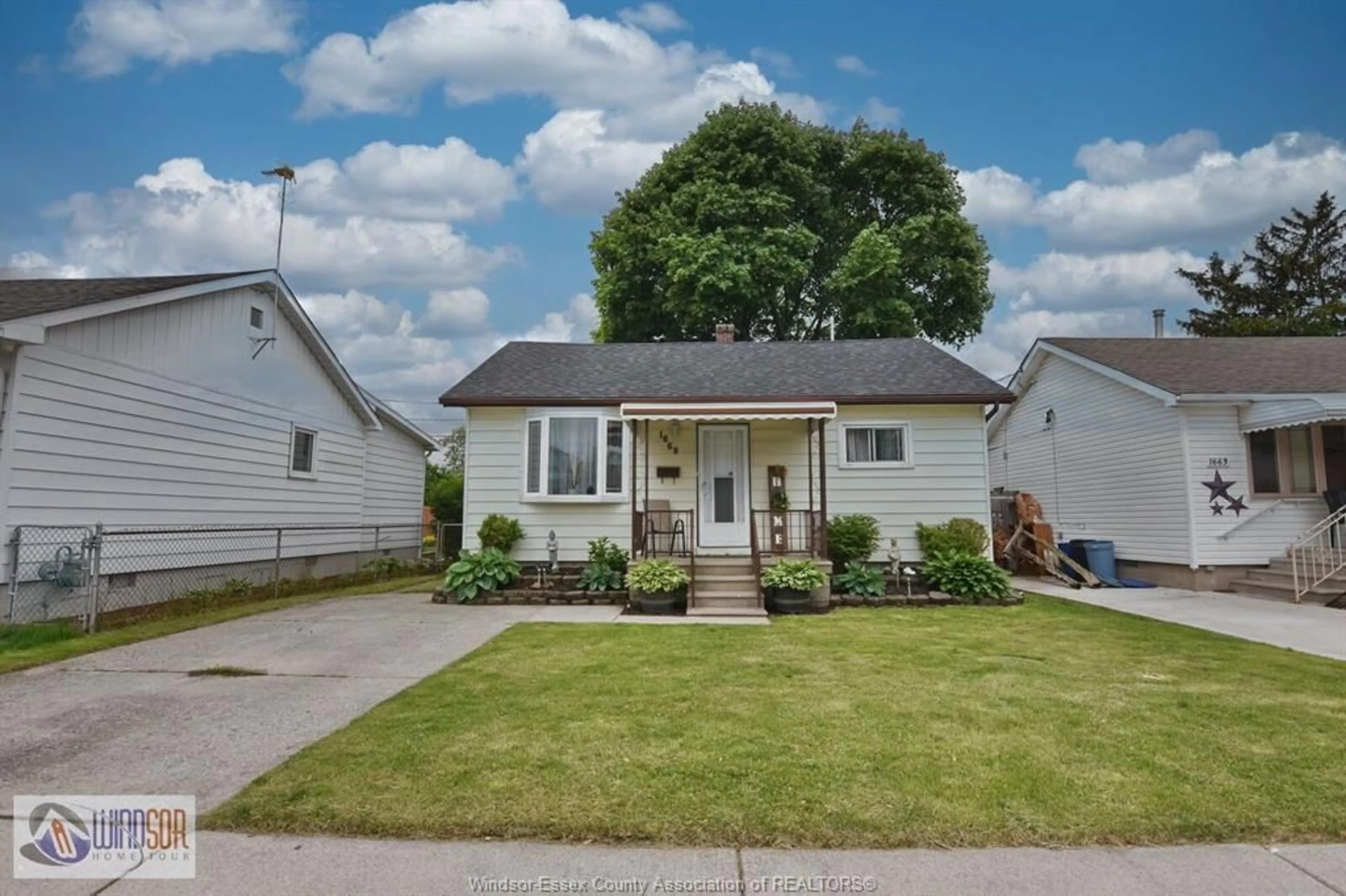 Home with vinyl exterior material, street for 1669 TOURANGEAU, Windsor Ontario N8Y 4J7