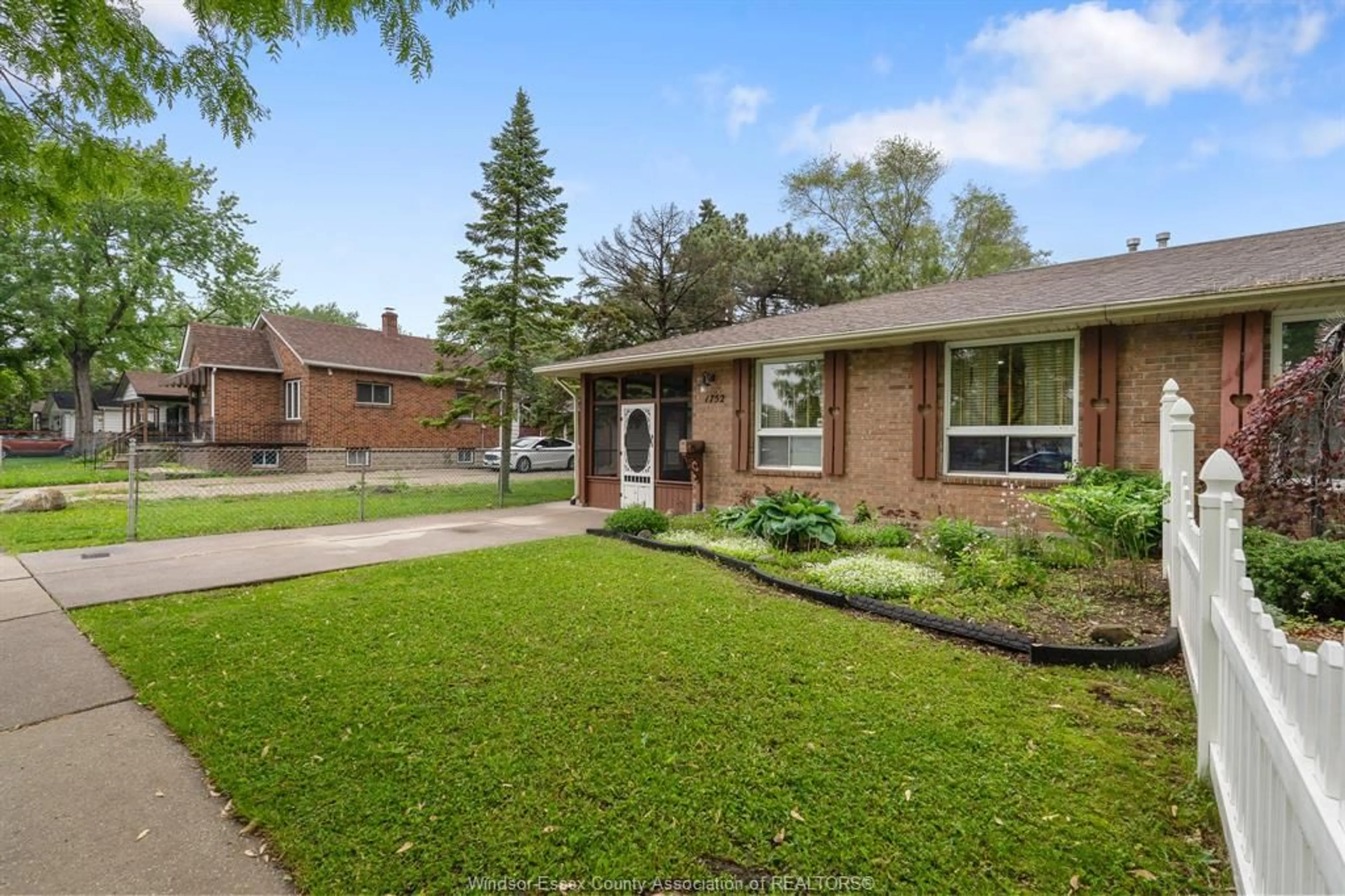 Home with brick exterior material, street for 1752 NORMAN Rd, Windsor Ontario N8Y 4N8