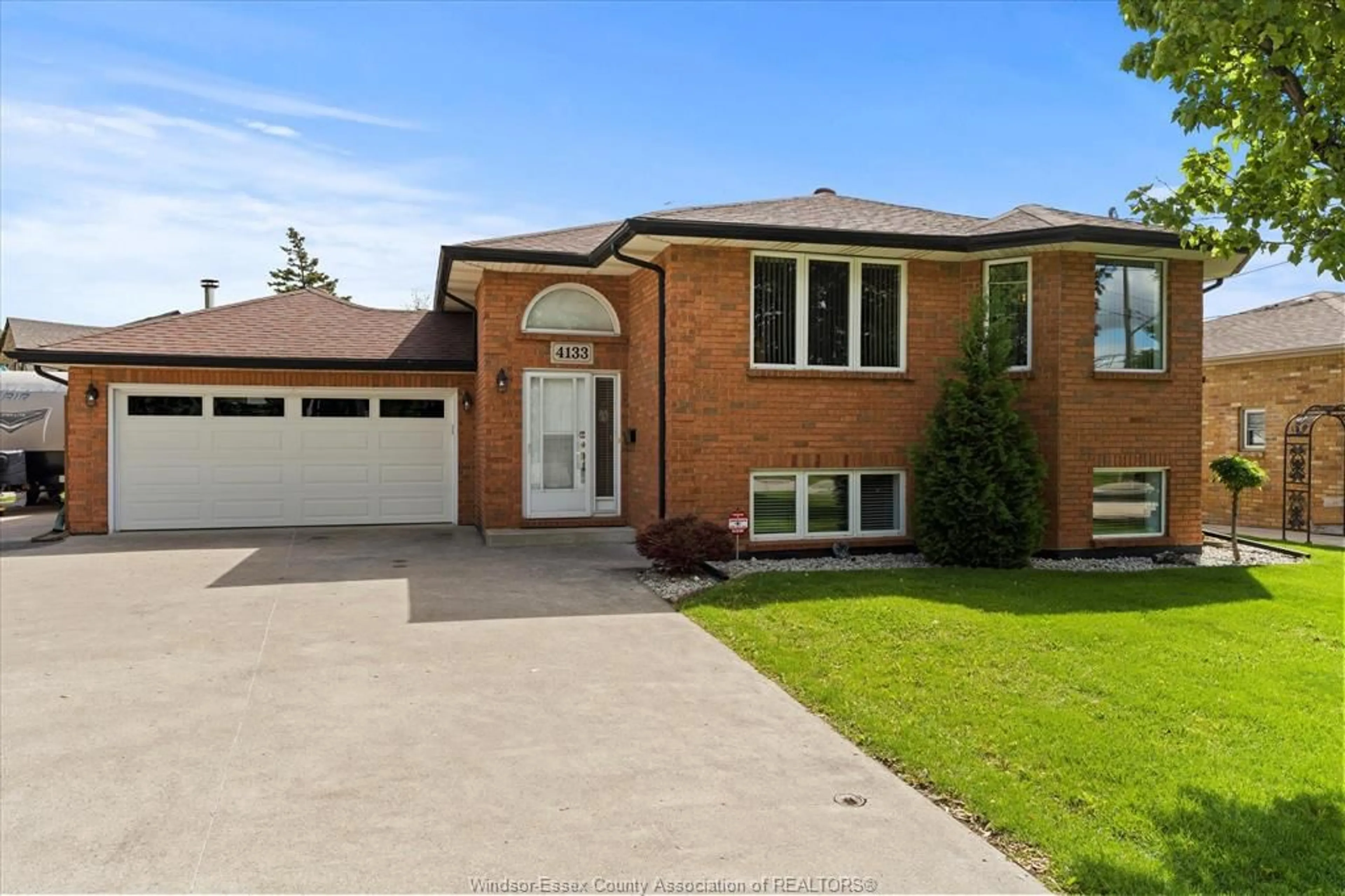 Home with brick exterior material, street for 4133 Grand Marais Rd, Windsor Ontario N8W 1X2