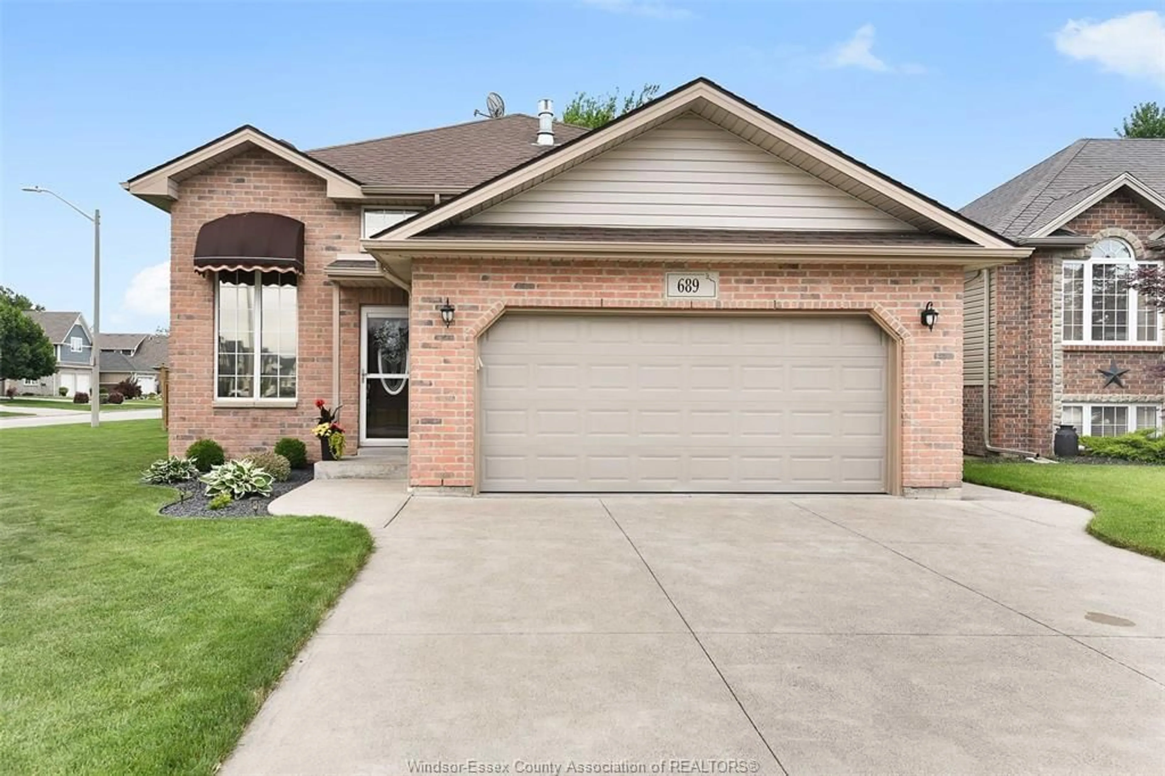 Home with brick exterior material, street for 689 Helena Cres, Belle River Ontario N0R 1A0