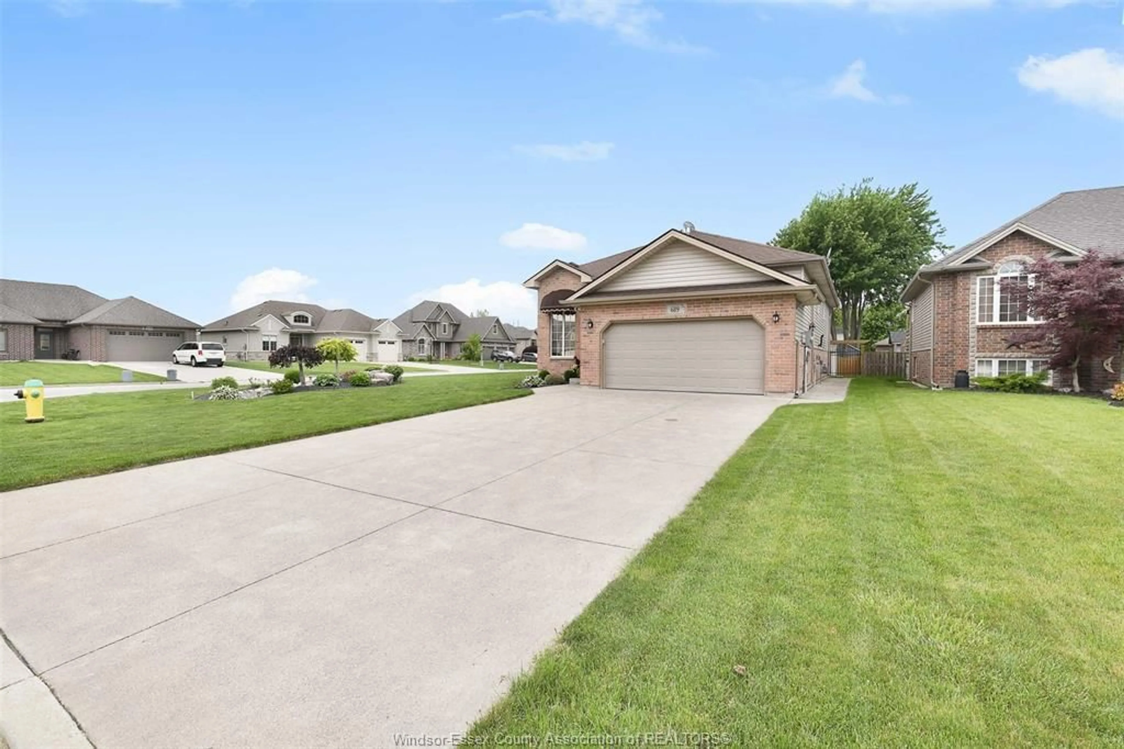 A pic from outside/outdoor area/front of a property/back of a property/a pic from drone, street for 689 Helena Cres, Belle River Ontario N0R 1A0