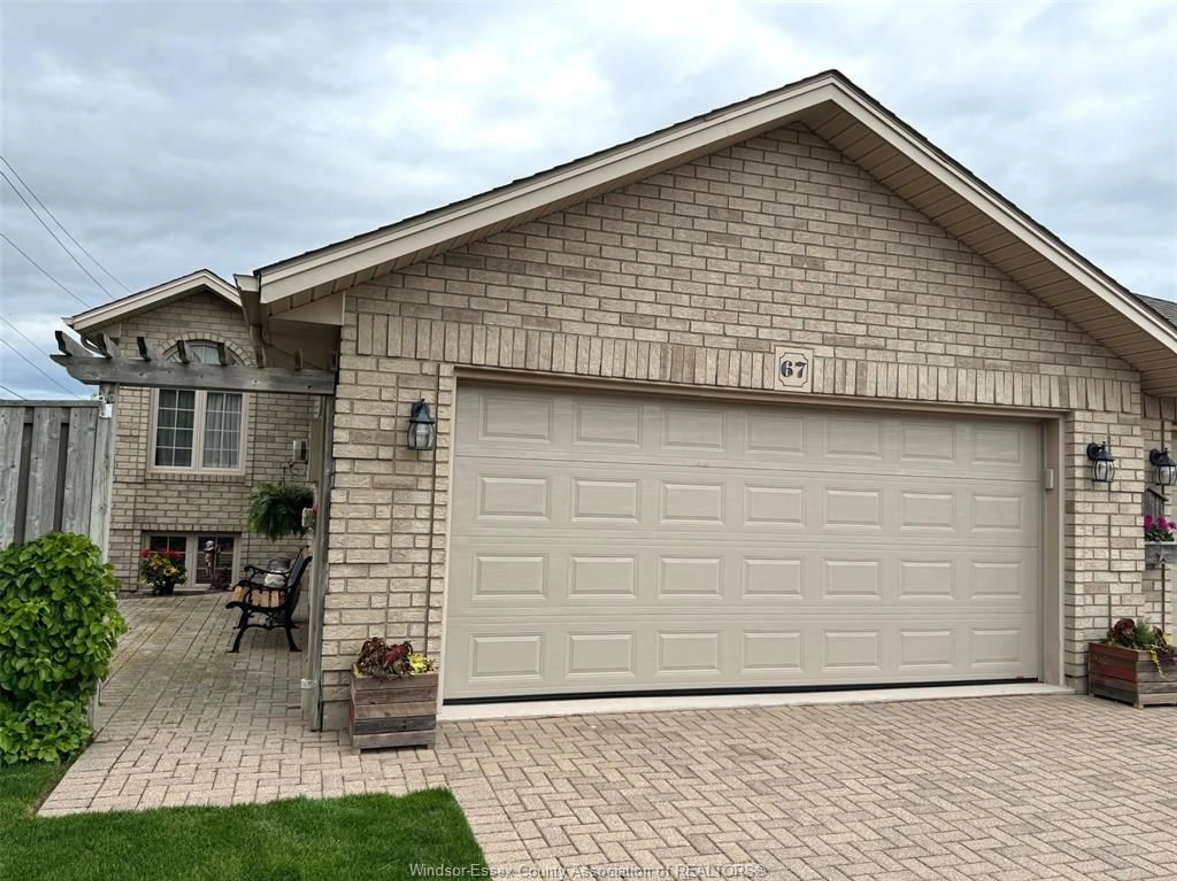 Home with brick exterior material, street for 67 QUEENS HILL Cres, Leamington Ontario N8H 5M5
