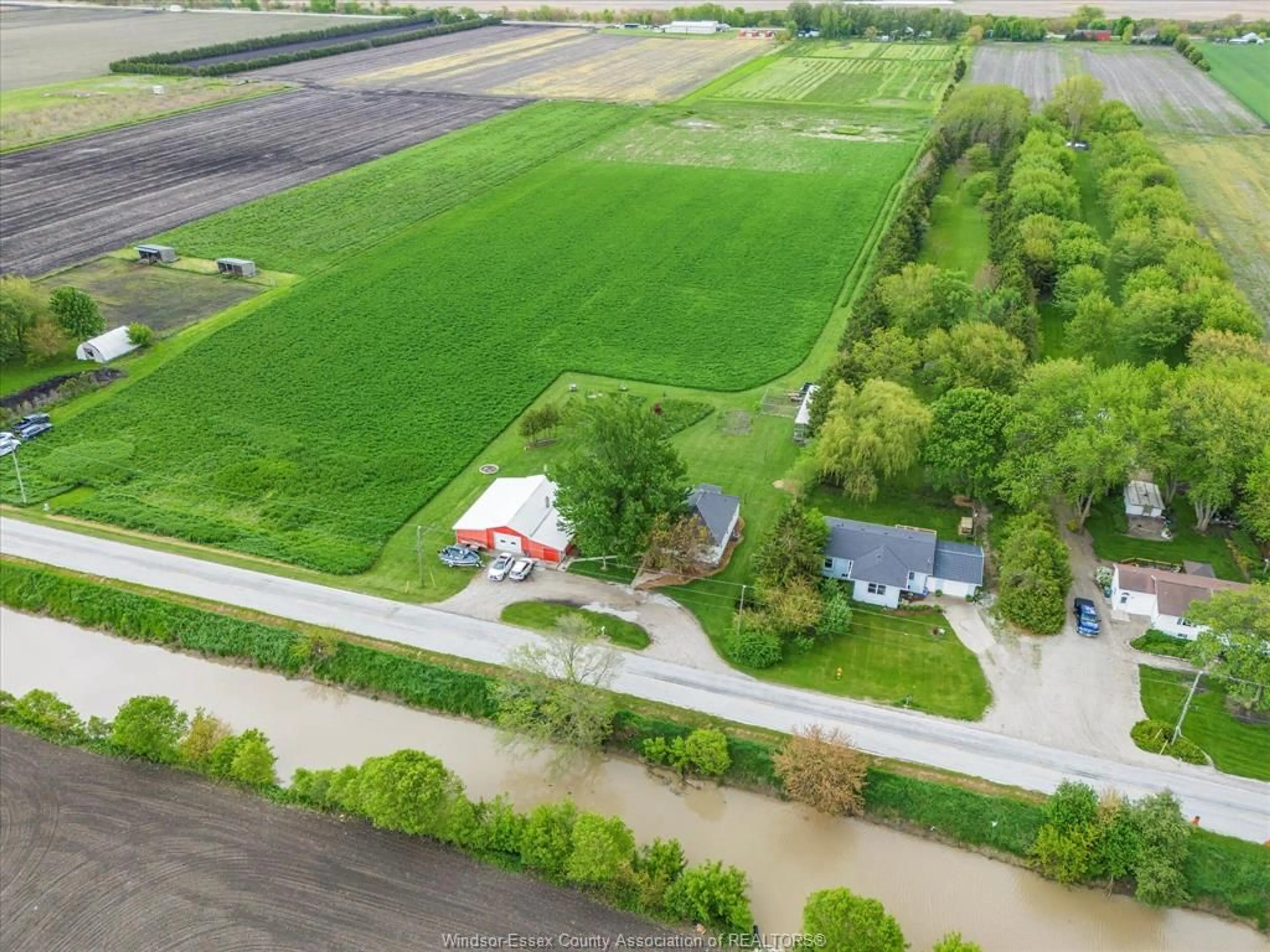 A pic from outside/outdoor area/front of a property/back of a property/a pic from drone, street for 1722 Mersea Rd D, Leamington Ontario N8H 3V4