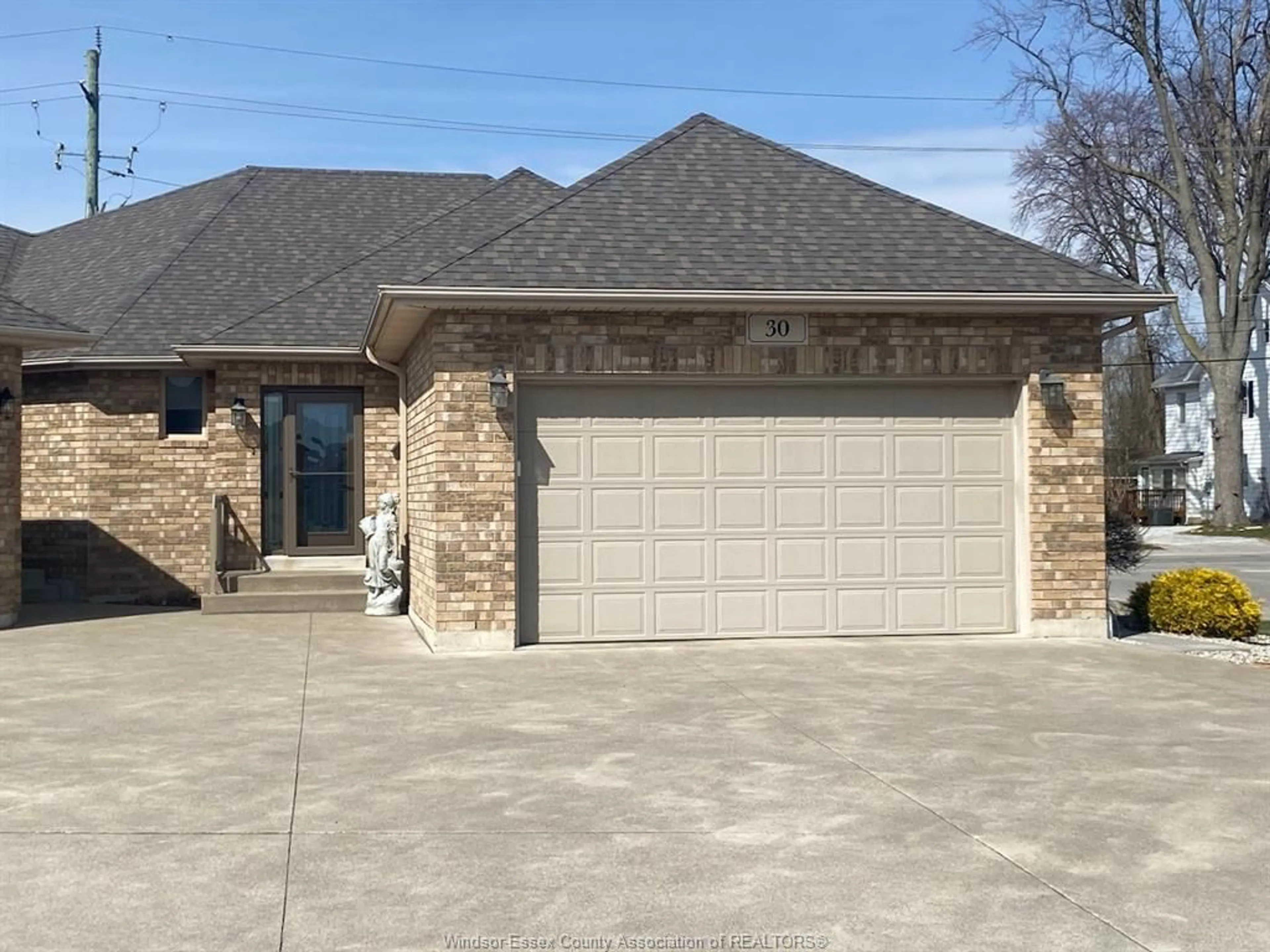 Home with brick exterior material, street for 30 METTAWAS Lane, Kingsville Ontario N9Y 0A2