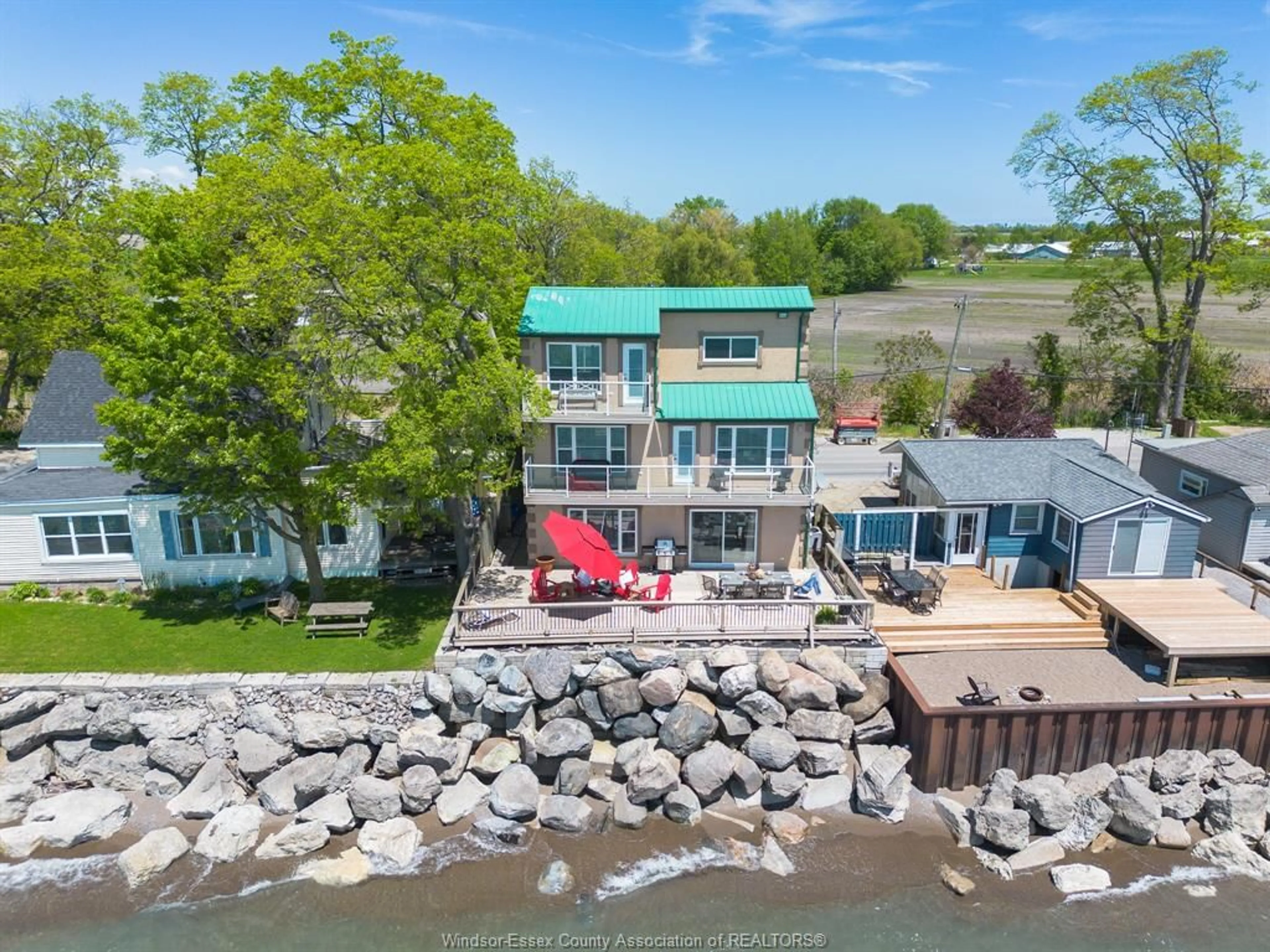 A pic from outside/outdoor area/front of a property/back of a property/a pic from drone, water/lake/river/ocean view for 992 Point Pelee Dr, Leamington Ontario N8H 3V4