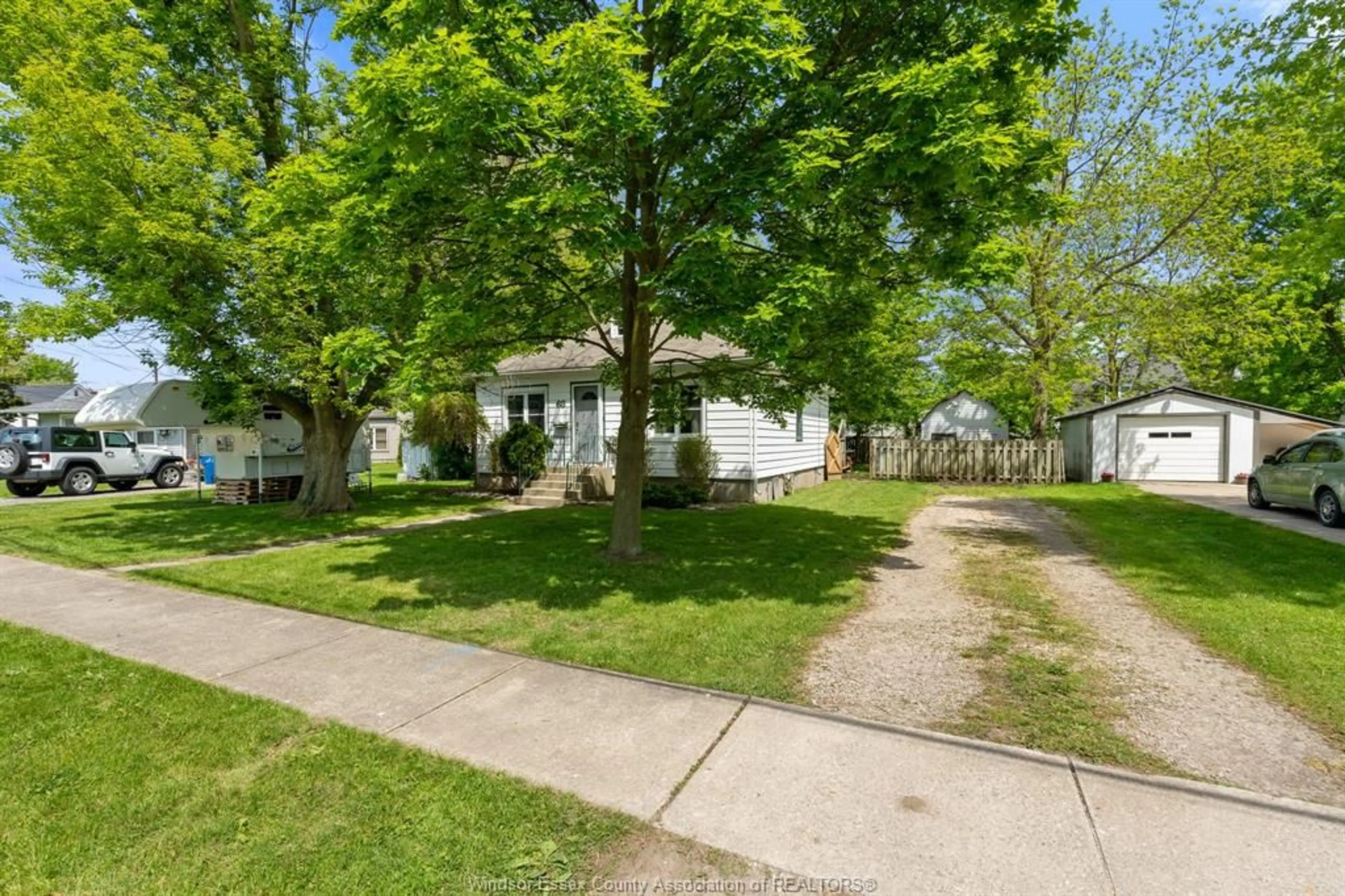 A pic from outside/outdoor area/front of a property/back of a property/a pic from drone, street for 63 Baird Ave, Wheatley Ontario N0P 2P0