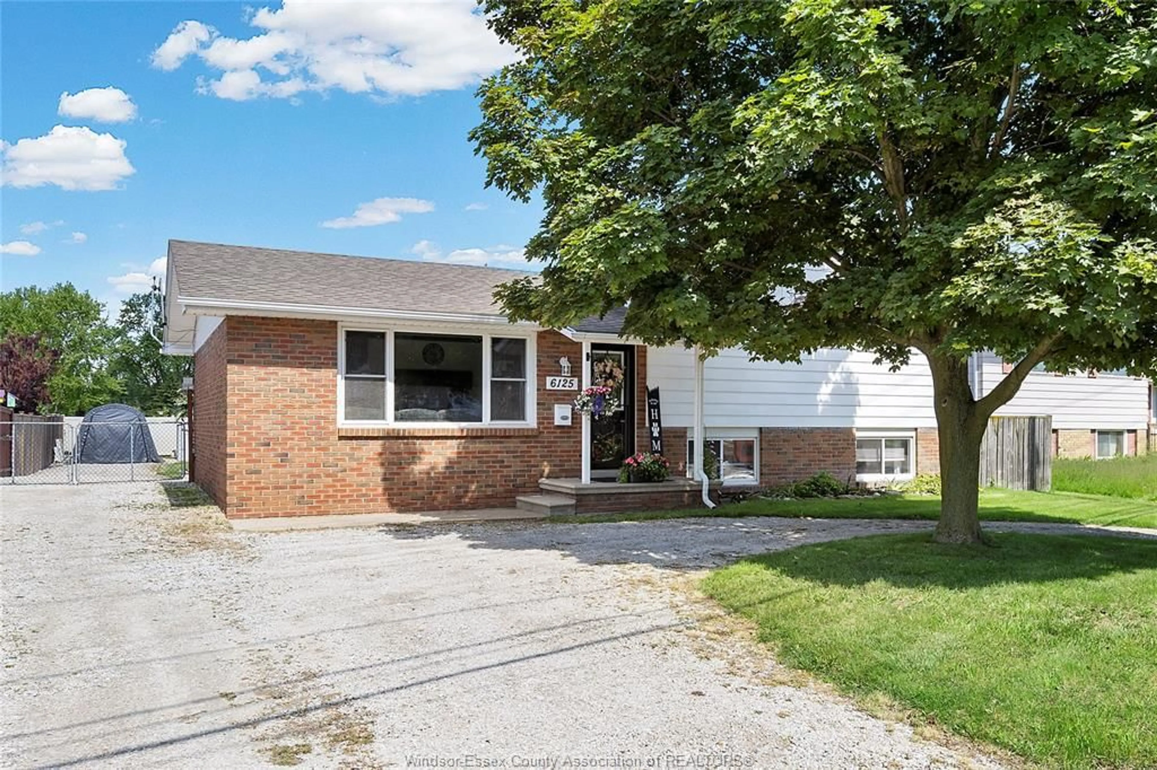 Home with brick exterior material, street for 6125 MATCHETTE Rd, LaSalle Ontario N9J 3B8