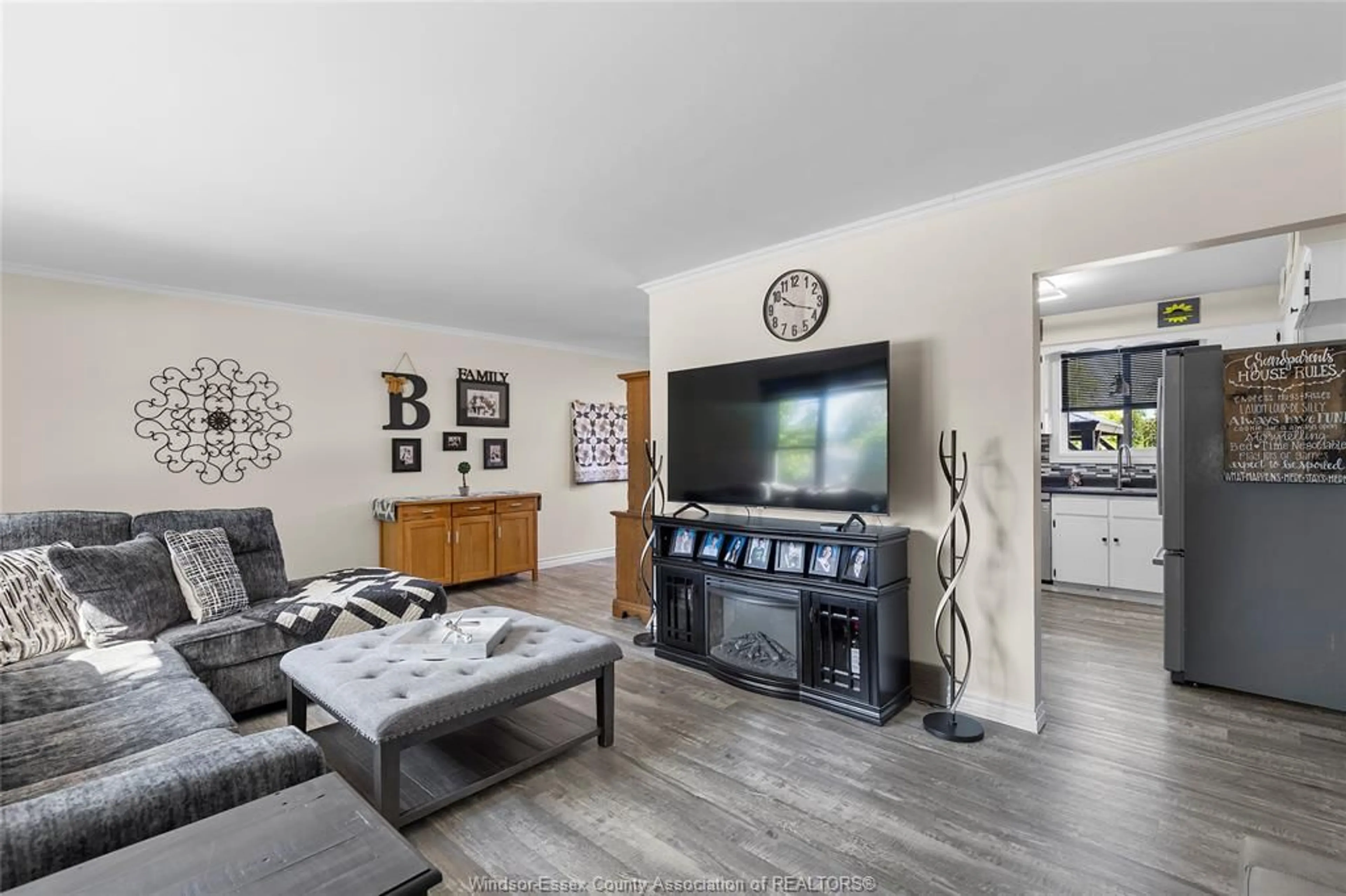 Living room with furniture, wood/laminate floor for 6125 MATCHETTE Rd, LaSalle Ontario N9J 3B8