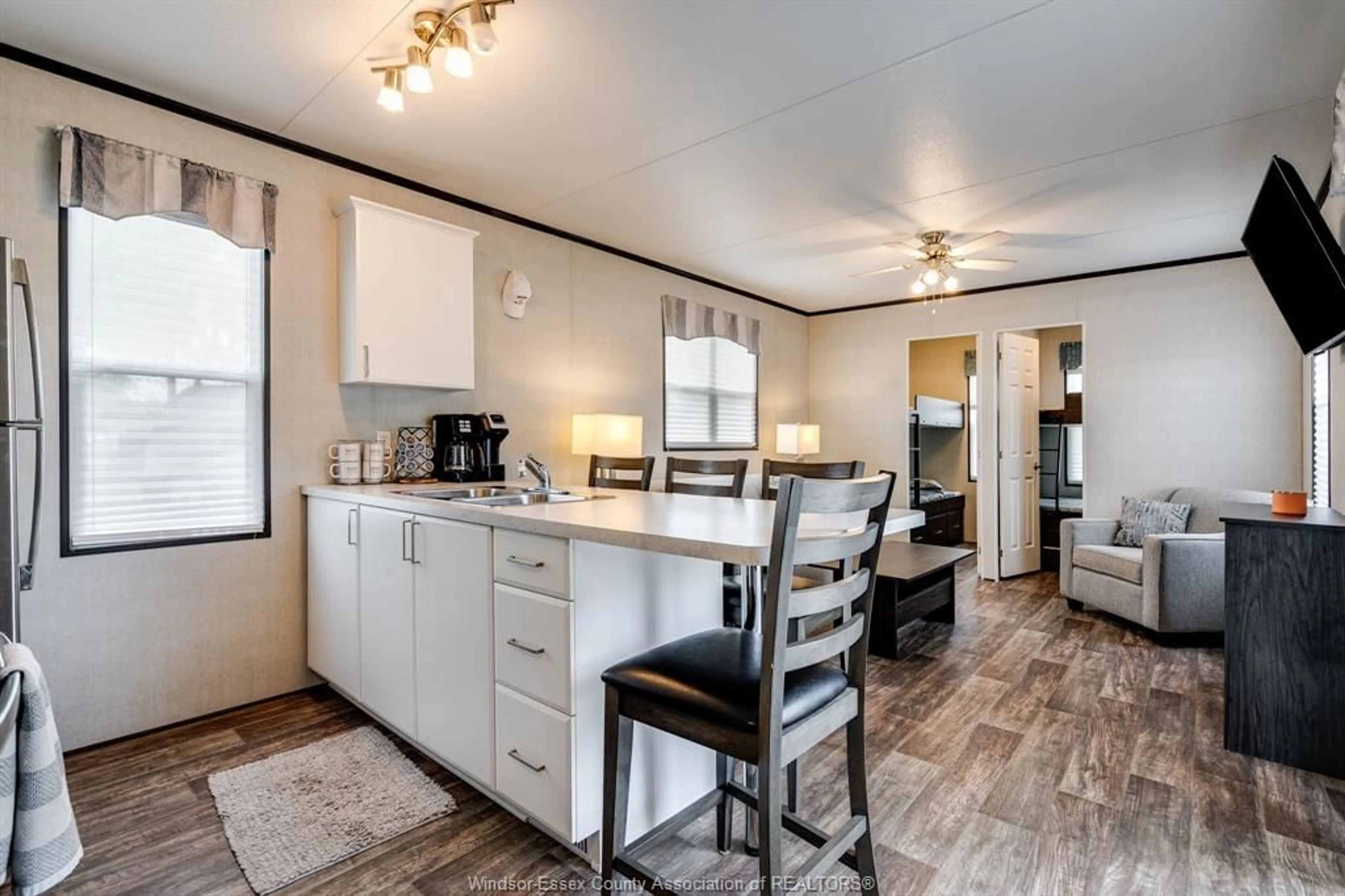 Open concept kitchen, wood/laminate floor for 981 County Rd 2 #522, Lakeshore Ontario N8N 4P4