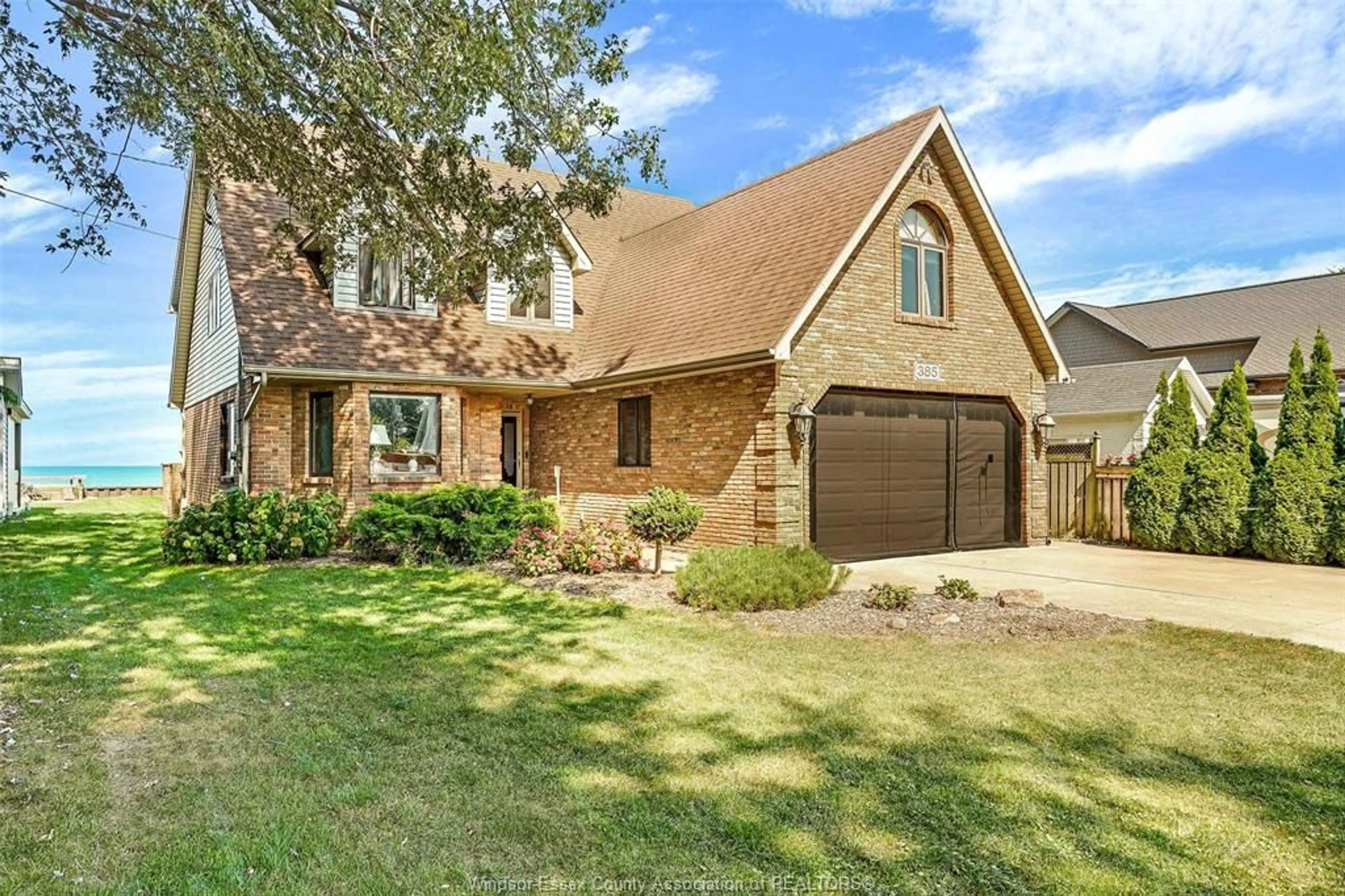 Home with brick exterior material, street for 385 LAKEVIEW Dr, Lakeshore Ontario N0R 1A0