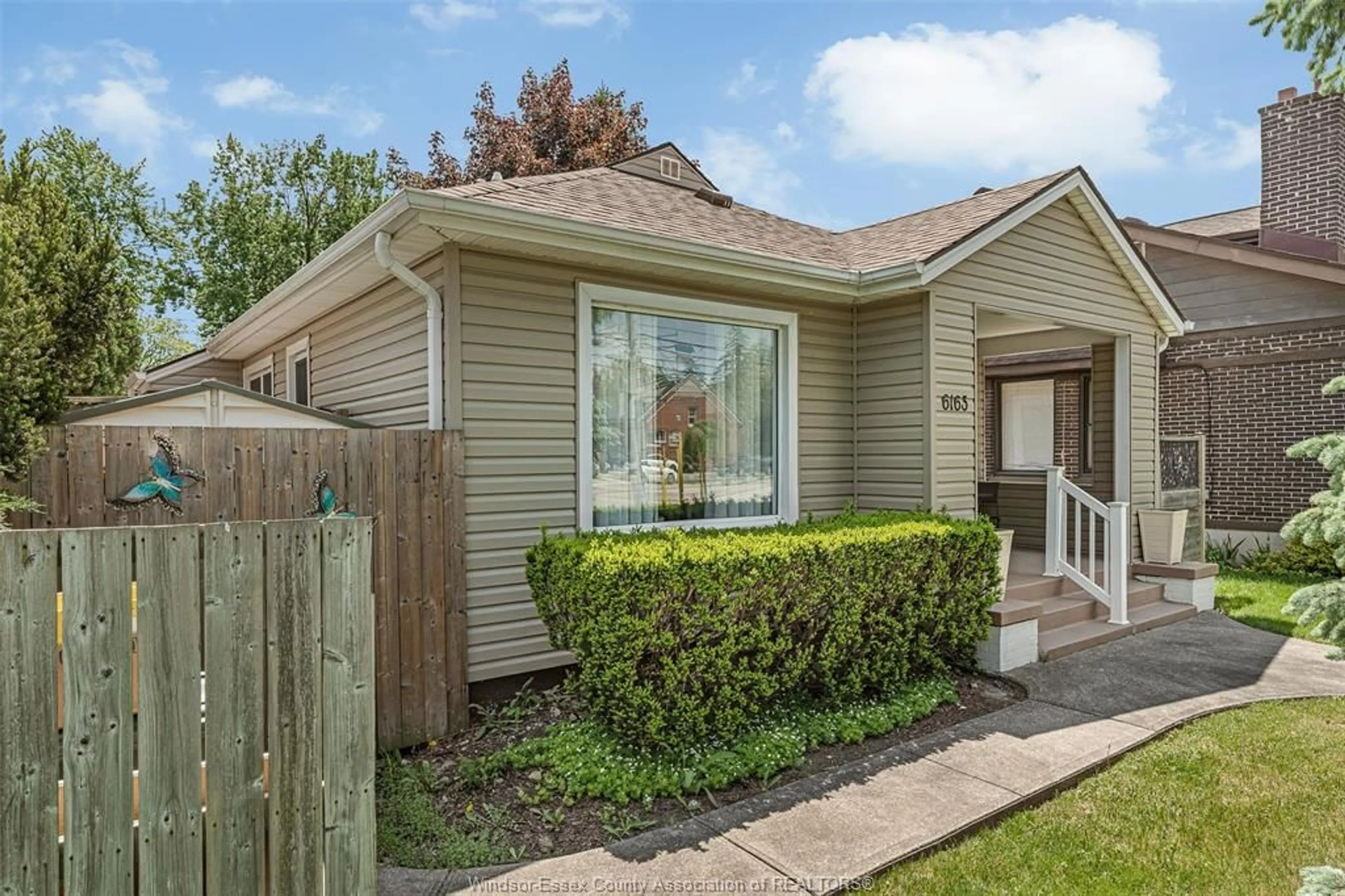 Home with vinyl exterior material, street for 6163 WYANDOTTE St, Windsor Ontario N8S 1N4