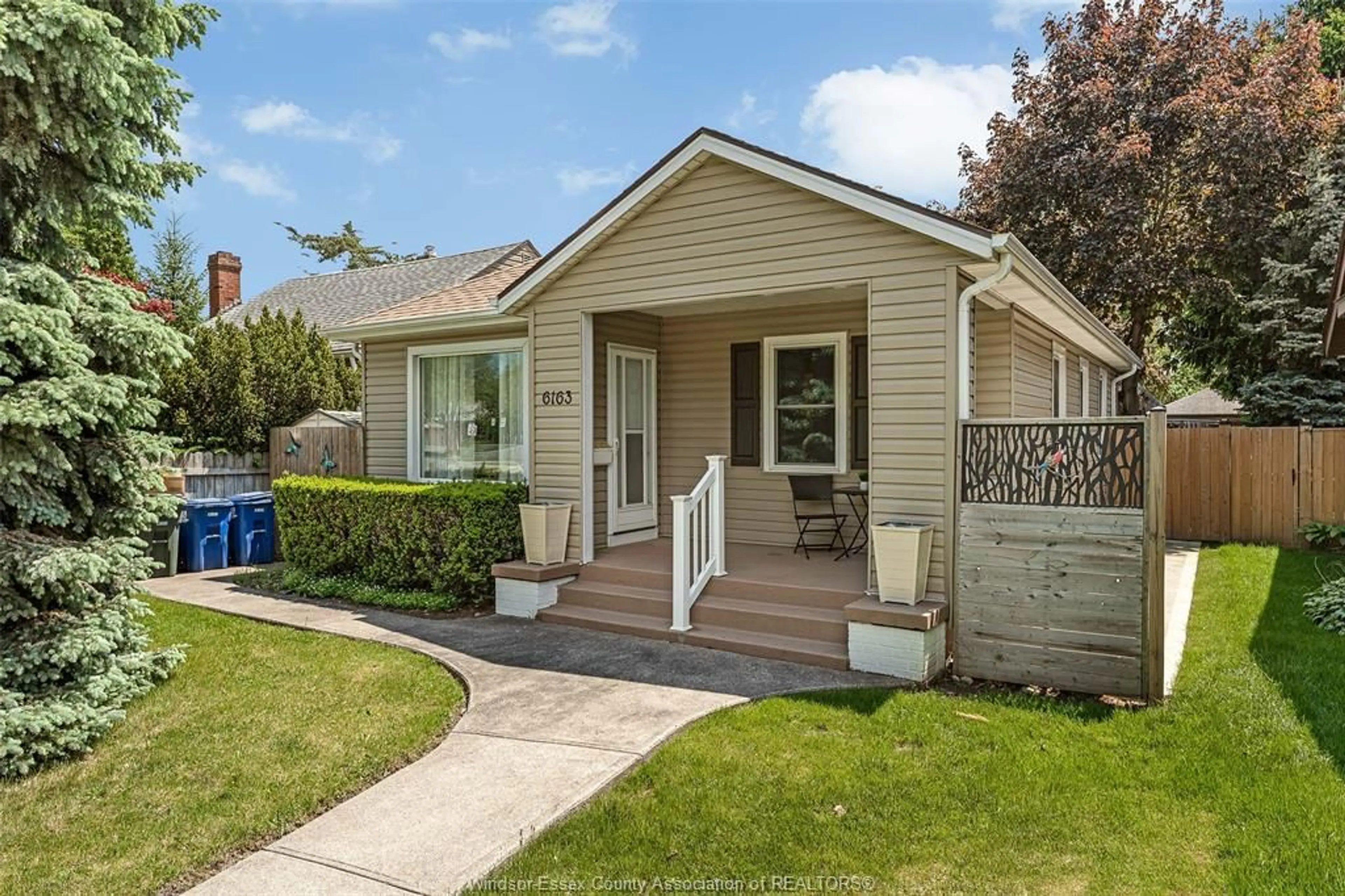 Home with vinyl exterior material, street for 6163 WYANDOTTE St, Windsor Ontario N8S 1N4