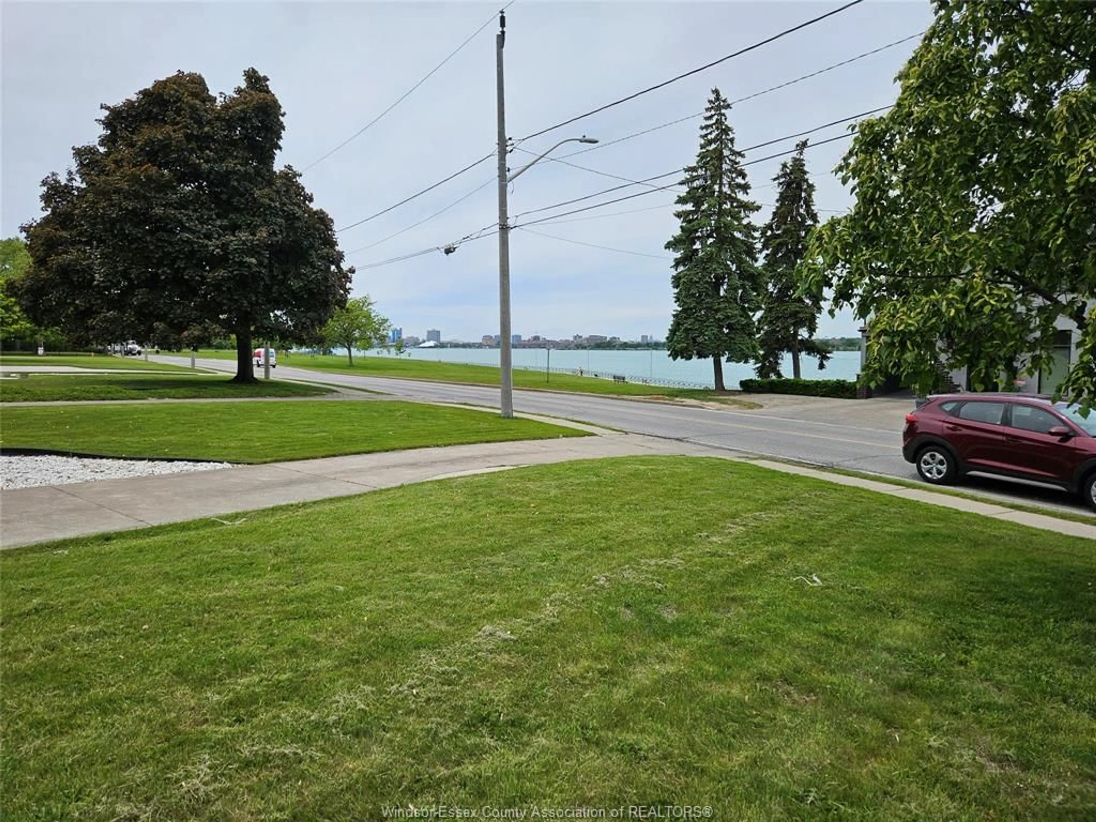 A pic from outside/outdoor area/front of a property/back of a property/a pic from drone, water/lake/river/ocean view for 4147 RIVERSIDE Dr, Windsor Ontario N8Y 1B4