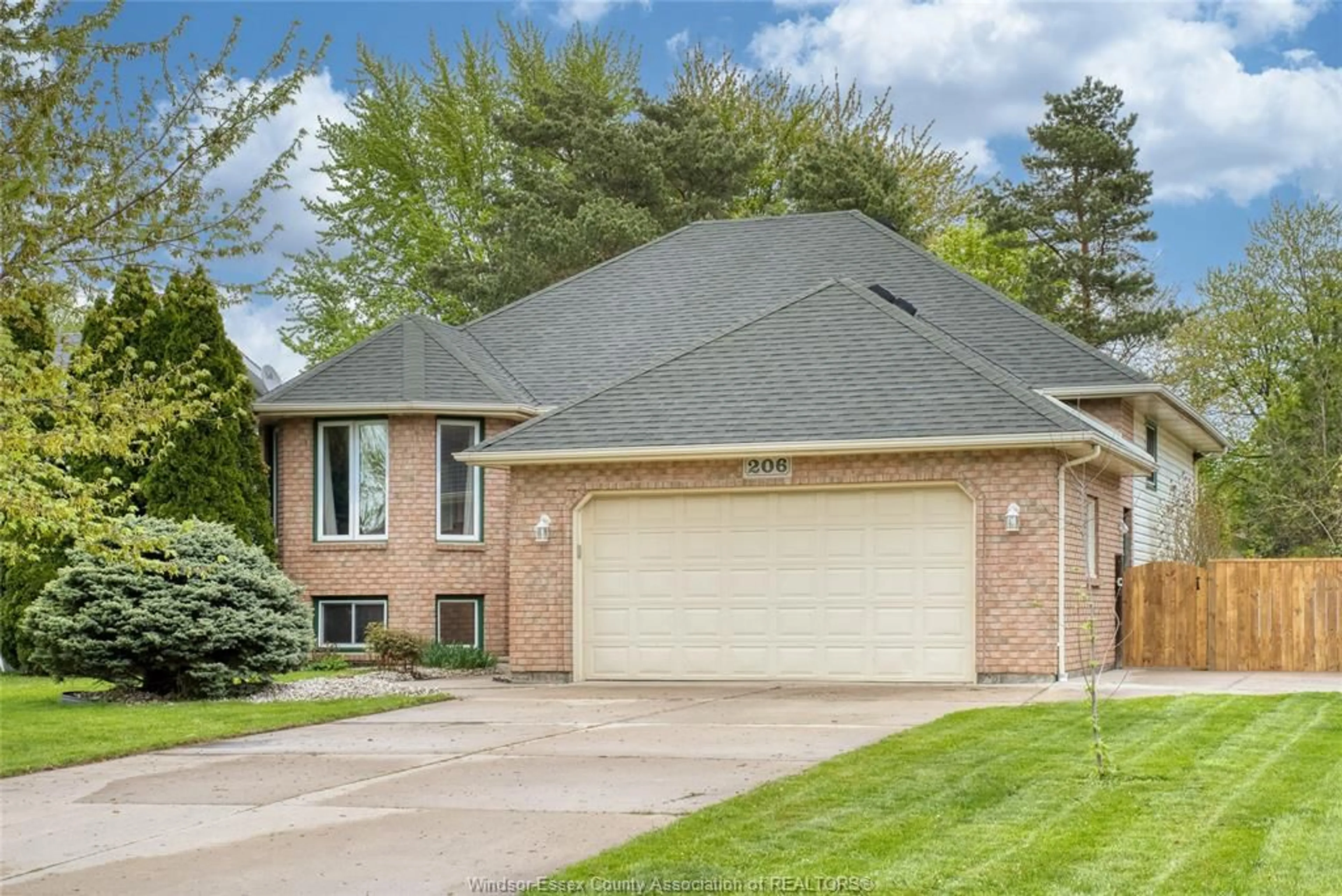 Home with brick exterior material, street for 206 MAPLEWOOD Dr, Lakeshore Ontario N8L 1C2