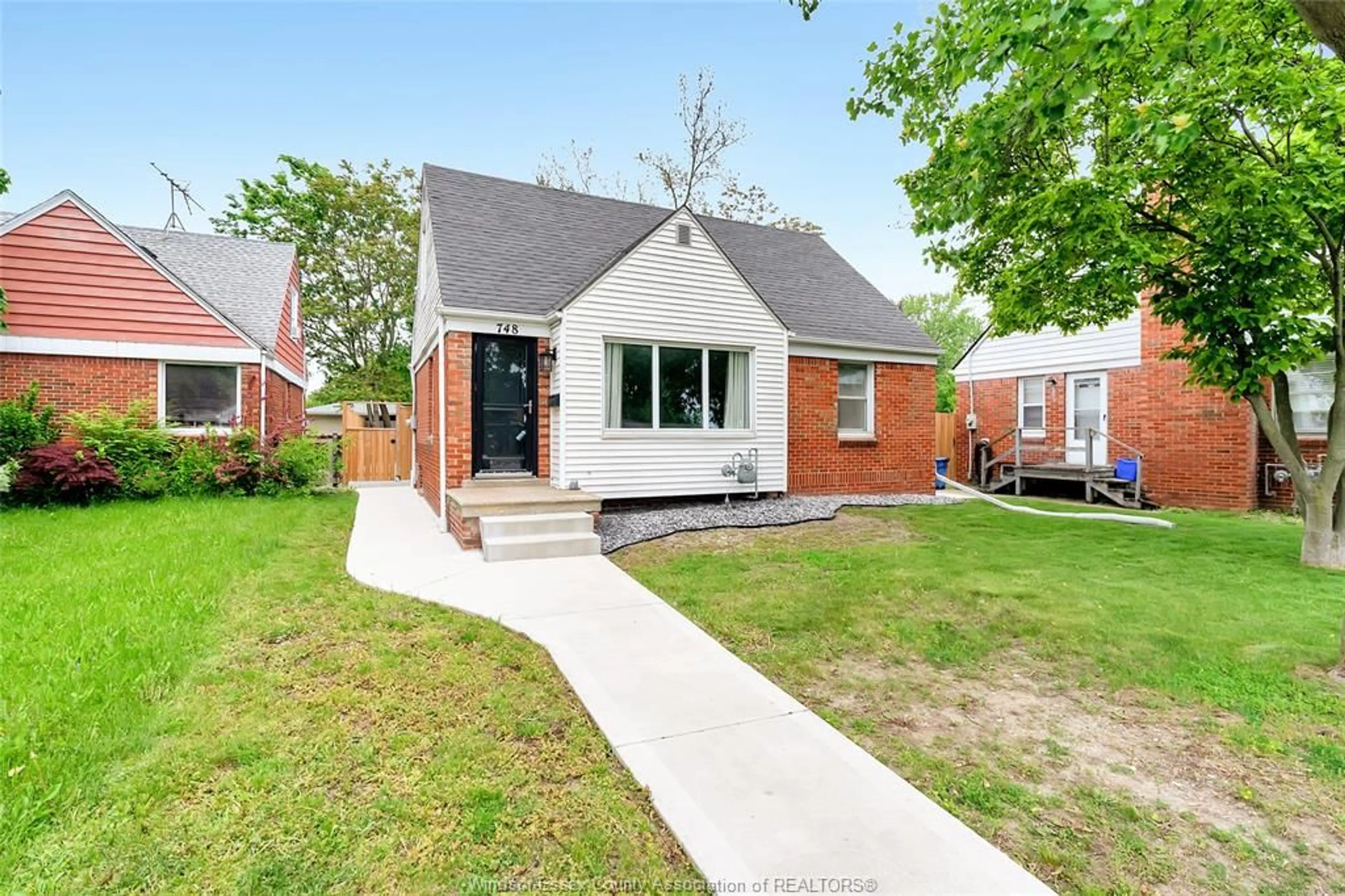 Home with brick exterior material, street for 748 MEMORIAL Dr, Windsor Ontario N8W 1W1