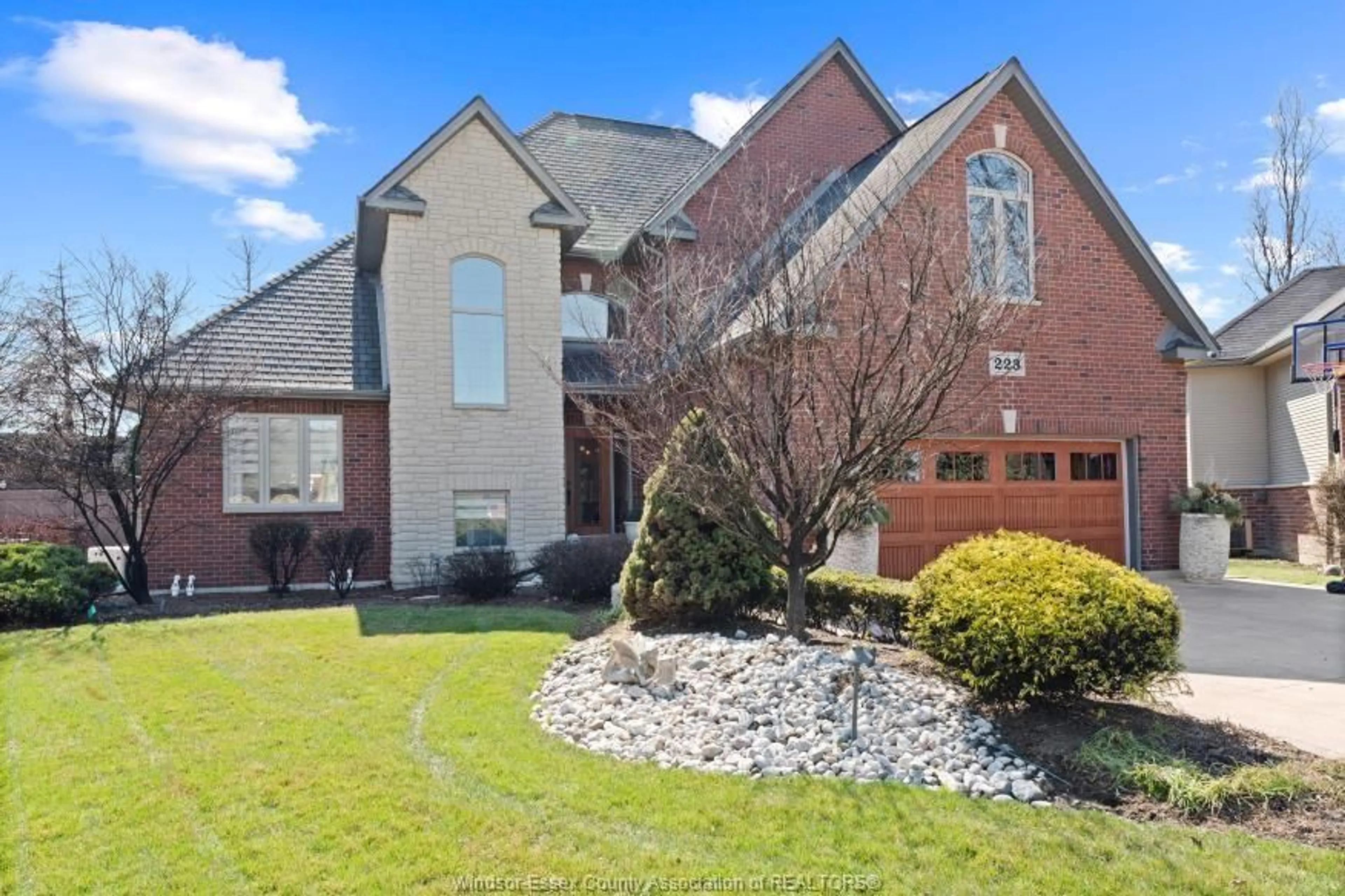 Home with brick exterior material, street for 223 LAURENDALE Dr, Lakeshore Ontario N8N 5E9