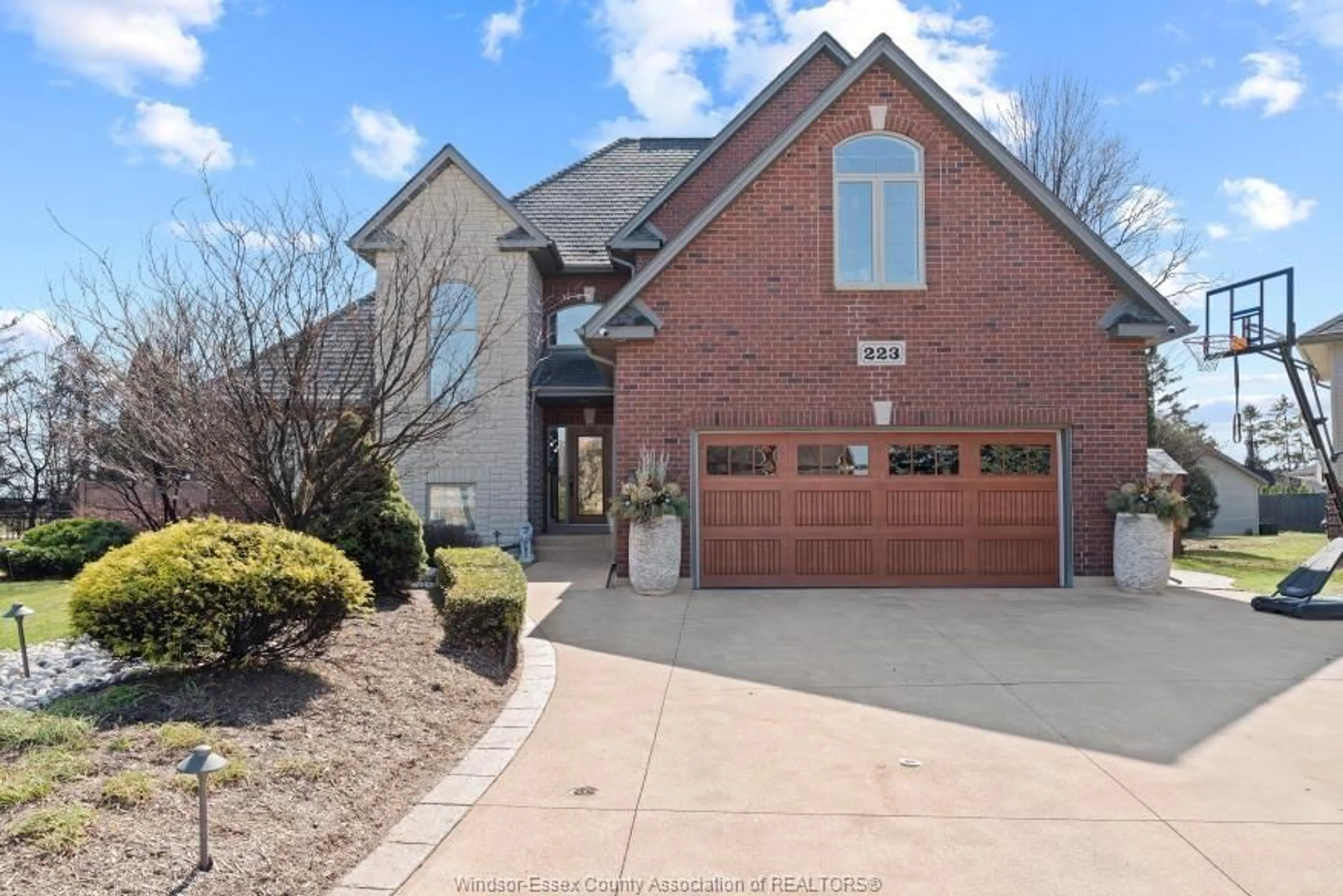 Home with brick exterior material, street for 223 LAURENDALE Dr, Lakeshore Ontario N8N 5E9