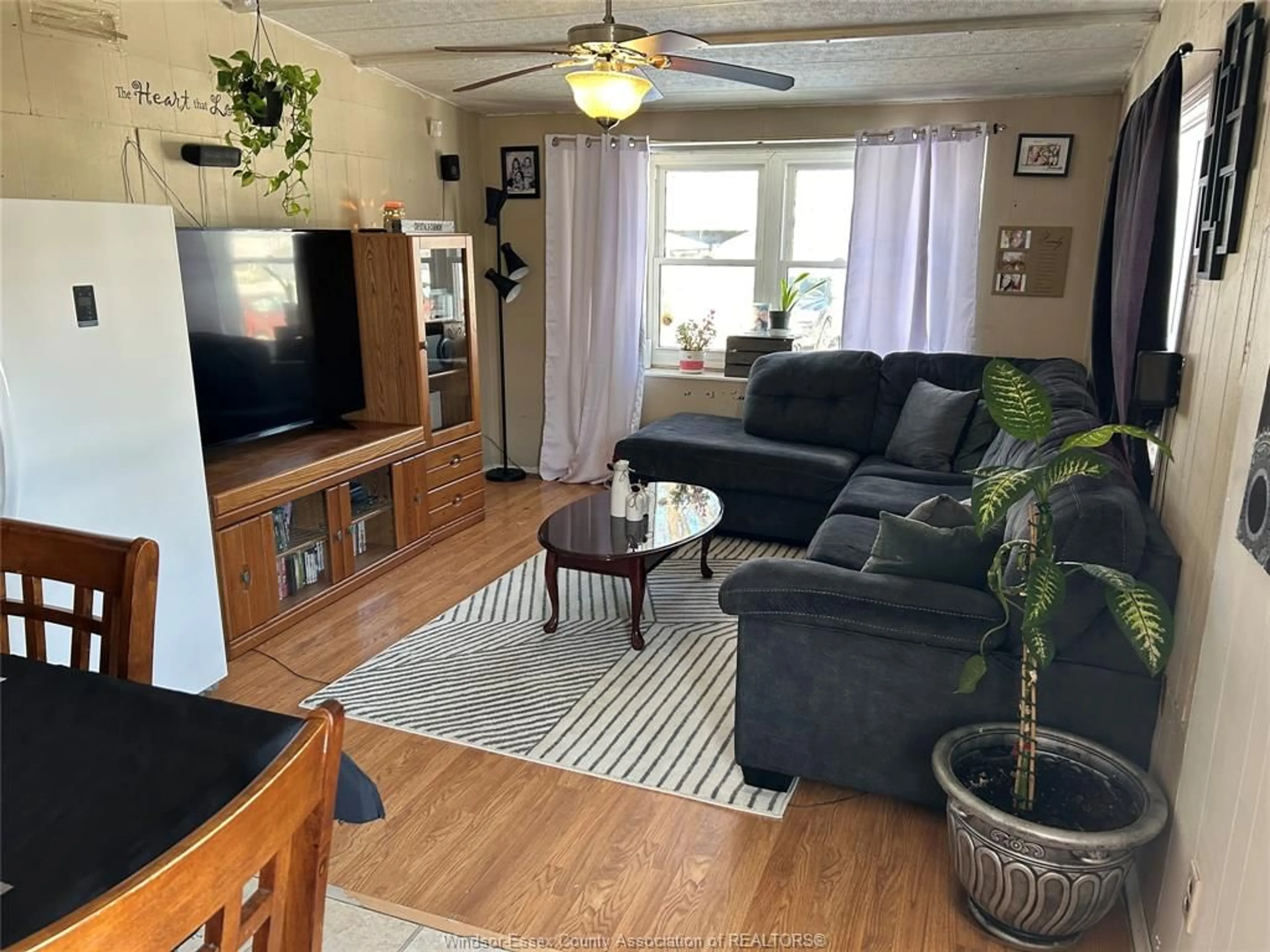 Living room with furniture, wood/laminate floor for 3 CYPRESS Crt, McGregor Ontario N0R 1J0