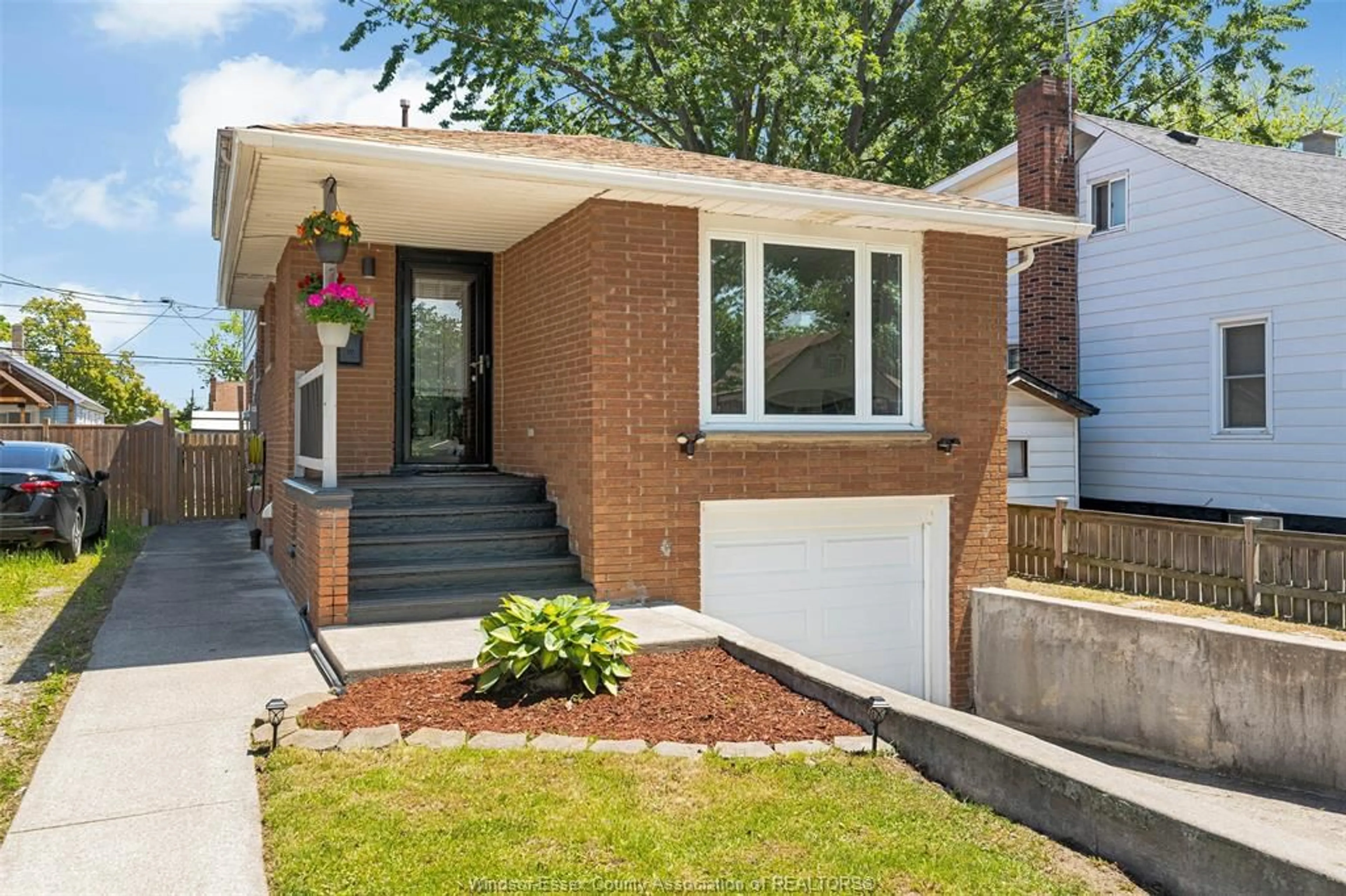 Home with brick exterior material, street for 1412 Pillette Road, Windsor Ontario N8Y 3B9