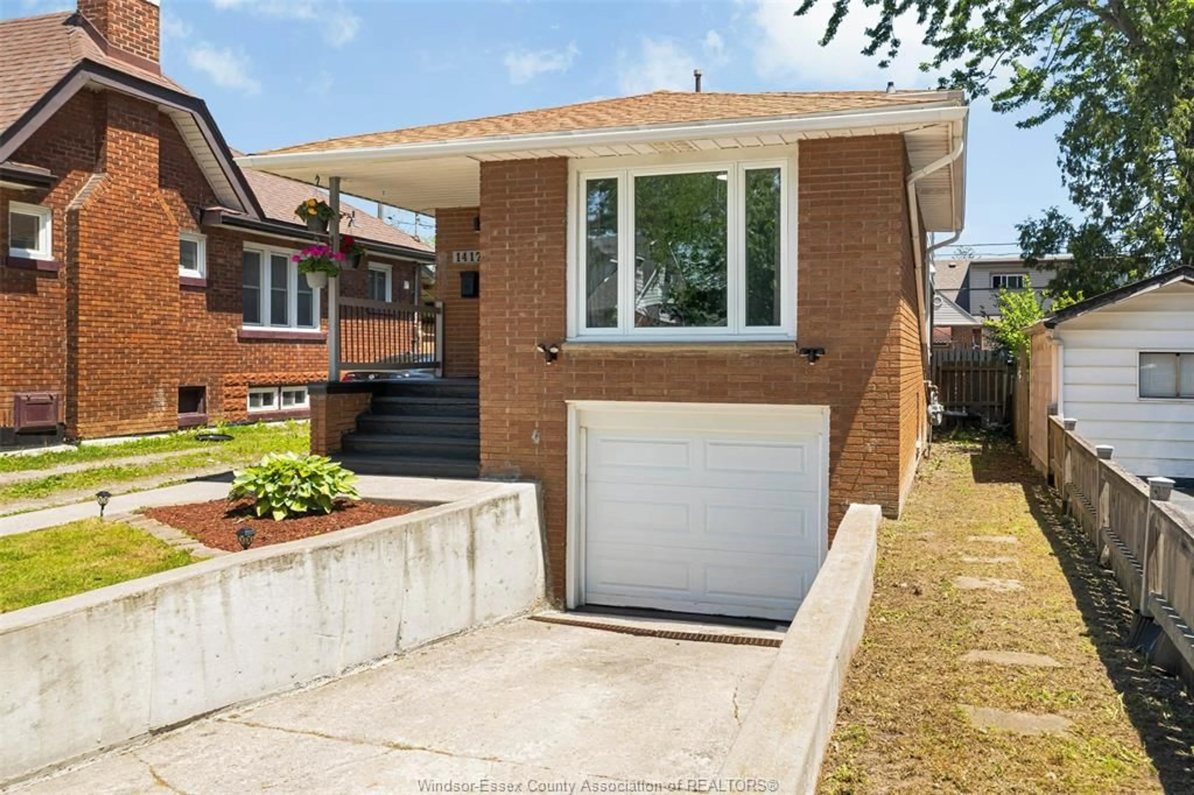 Home with brick exterior material, street for 1412 Pillette Road, Windsor Ontario N8Y 3B9