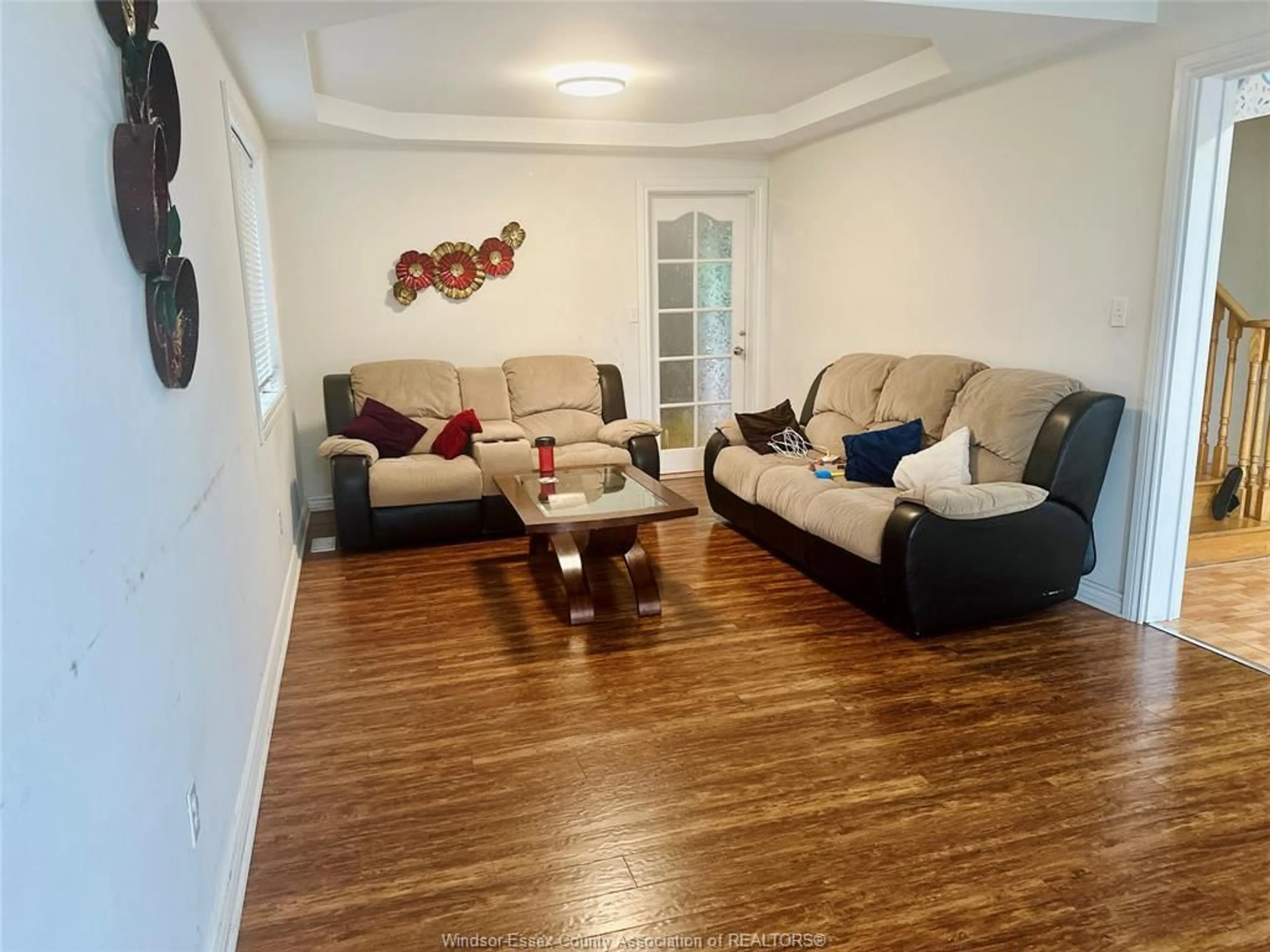 Living room with furniture, wood/laminate floor for 4562 UNICORN Ave, Windsor Ontario N9G 3G6