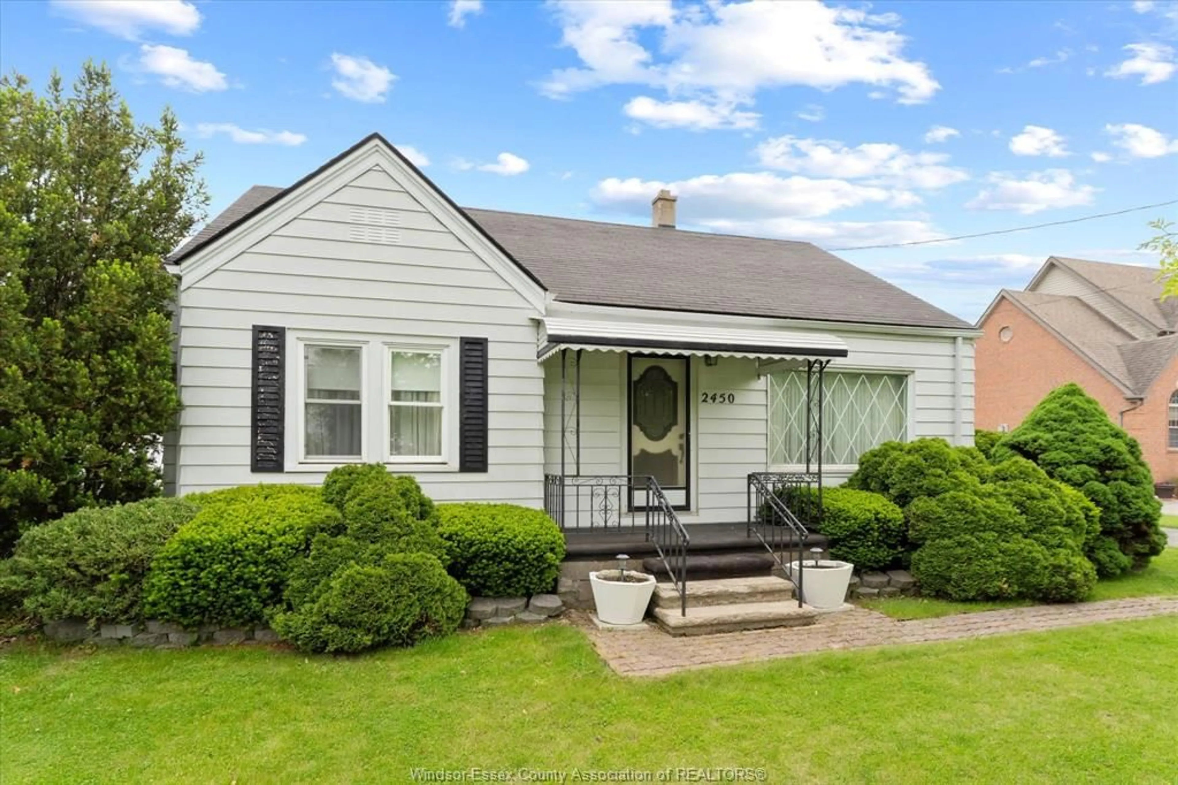 Home with vinyl exterior material, street for 2450 LESPERANCE, Tecumseh Ontario N8N 2W5