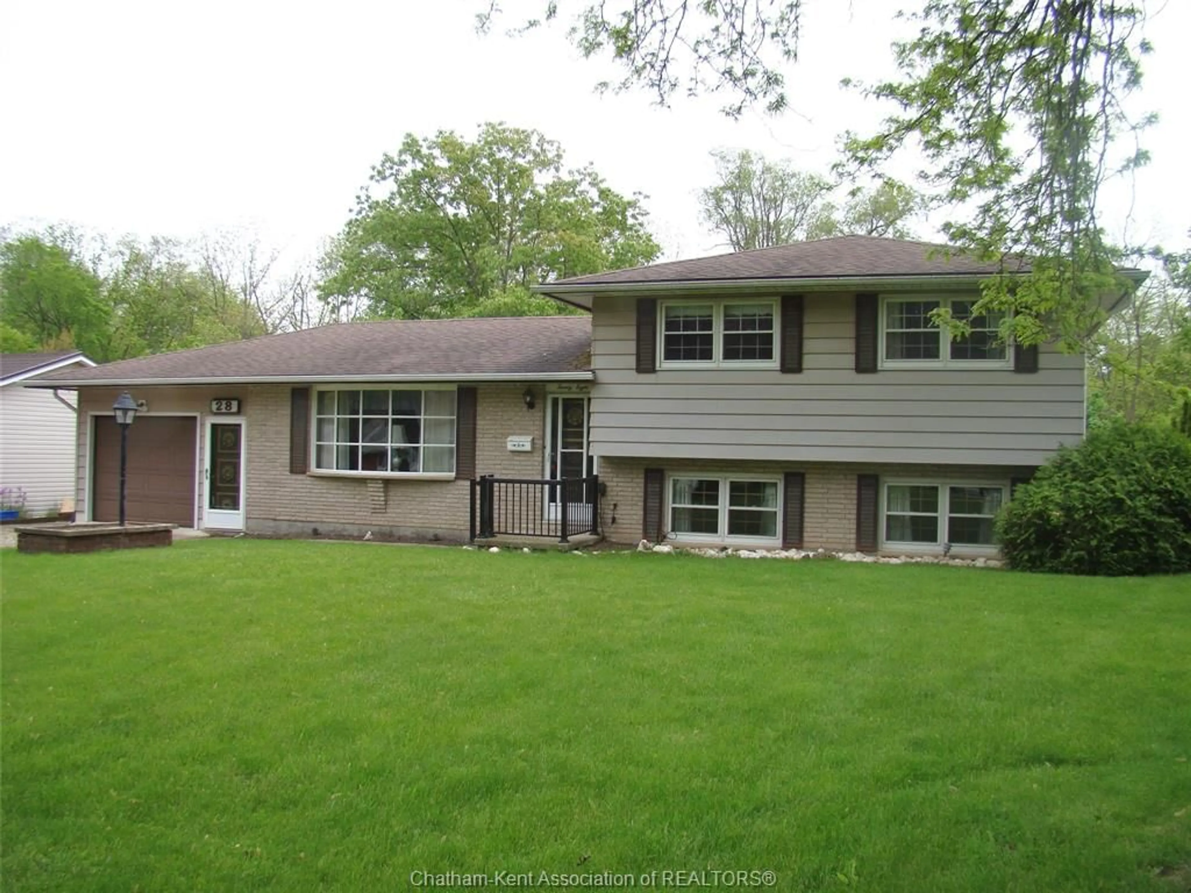 Home with vinyl exterior material, street for 28 OAK St, Ridgetown Ontario N0P 2C0