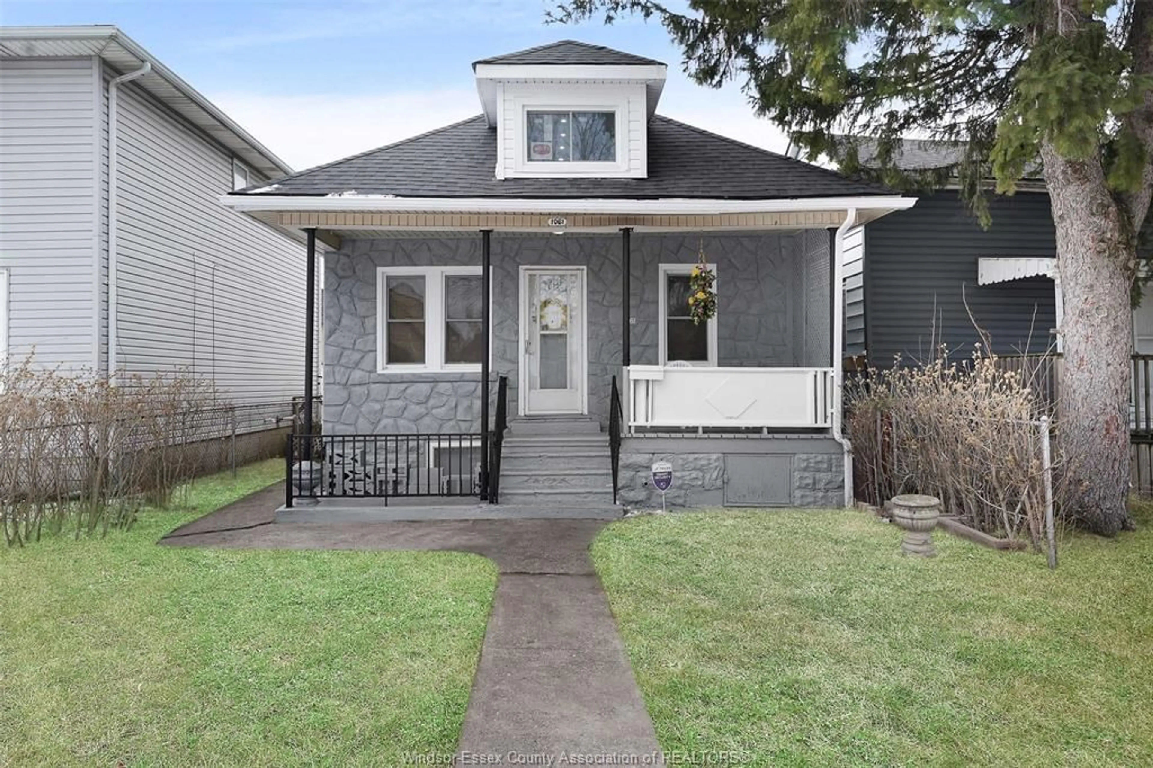 Home with vinyl exterior material, street for 1061 HIGHLAND Ave, Windsor Ontario N9A 1R6