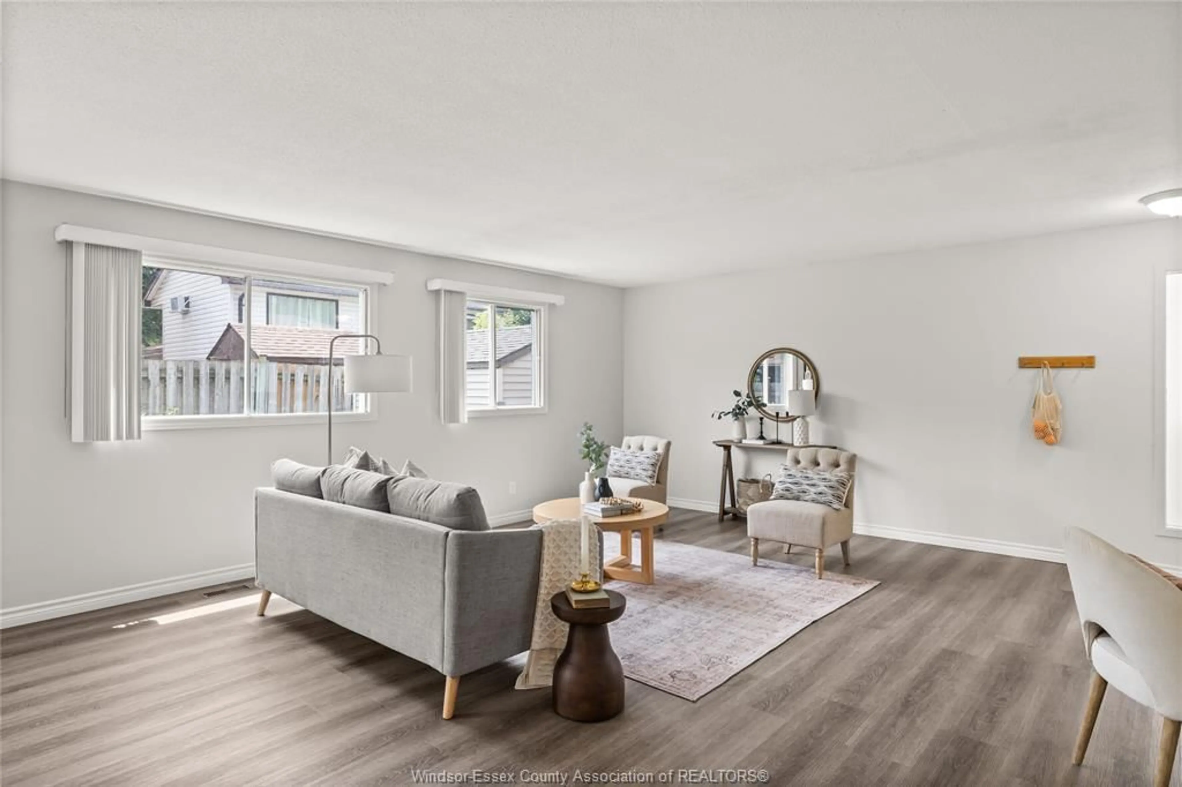 Living room with furniture, wood/laminate floor for 8245 LITTLE RIVER Rd, Windsor Ontario N8S 4P1