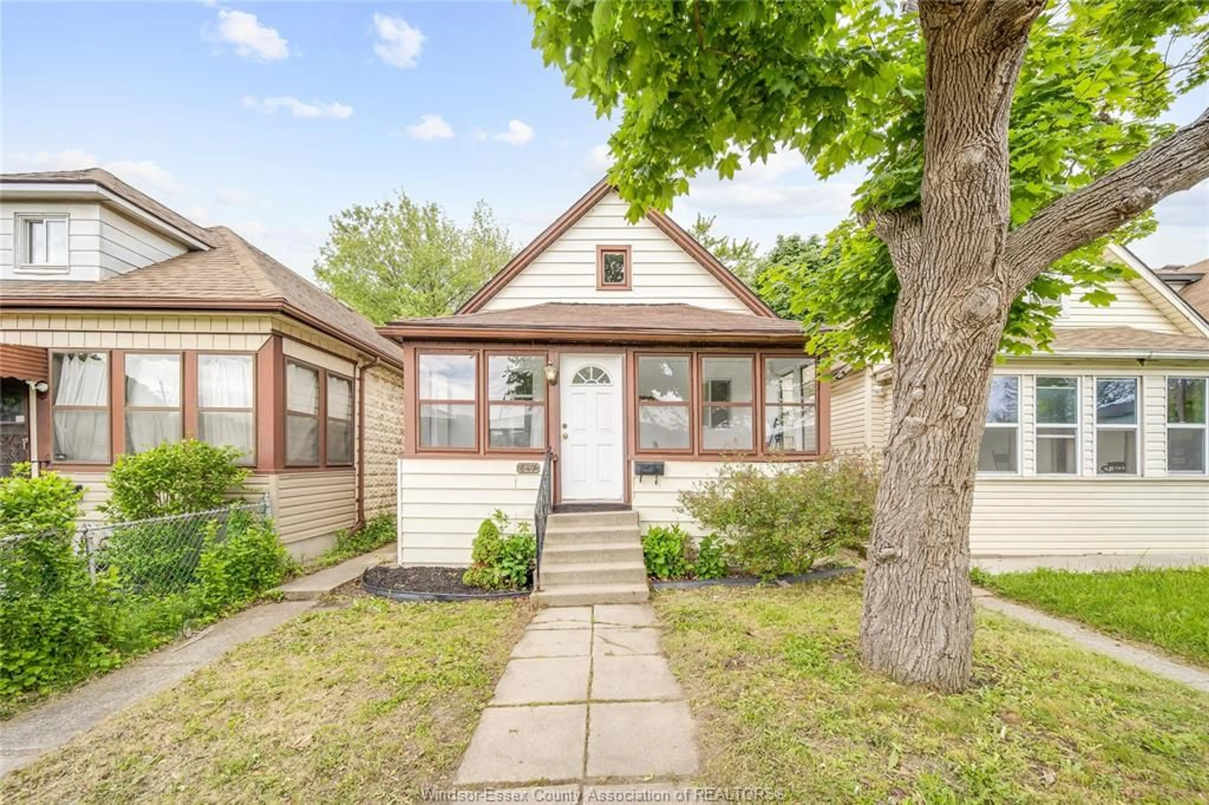 Home with brick exterior material, street for 567 BRIDGE Ave, Windsor Ontario N9B 2M3
