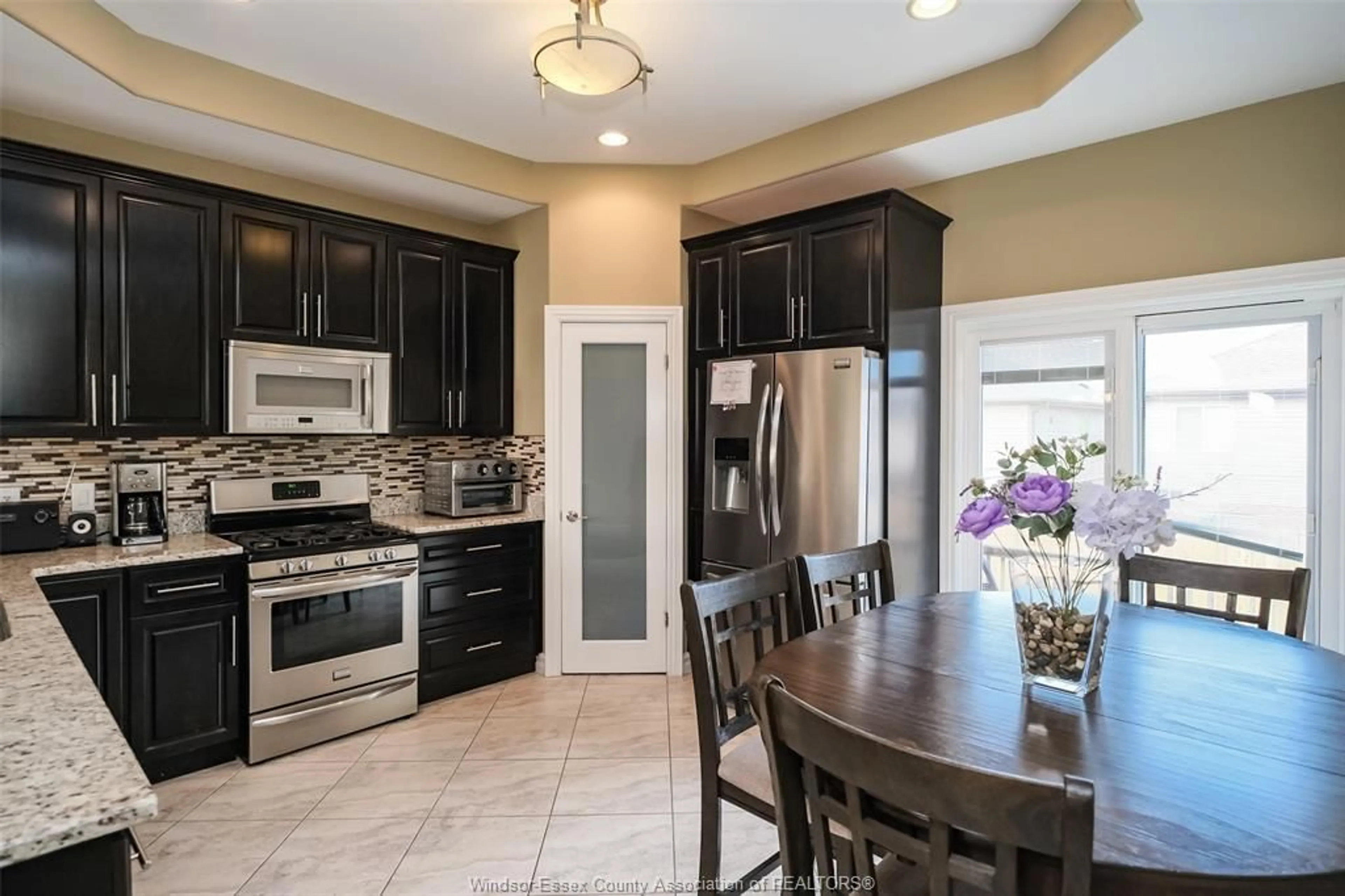 Open concept kitchen, ceramic/tile floor for 4847 PERIWINKLE Cres, Windsor Ontario N9G 3G8