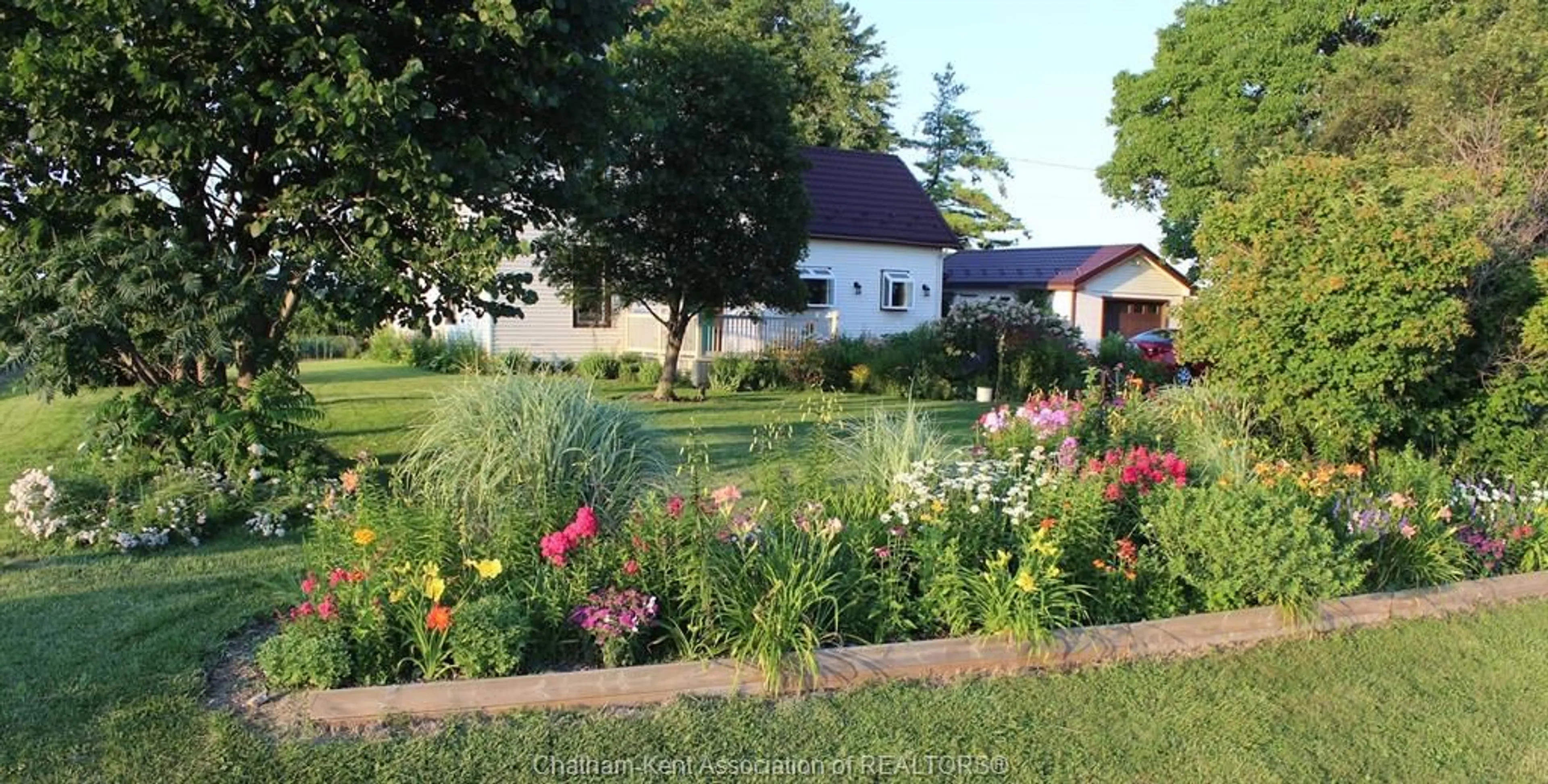 A pic from outside/outdoor area/front of a property/back of a property/a pic from drone, street for 21983 Communication Rd, Chatham-Kent Ontario N7M 5J3