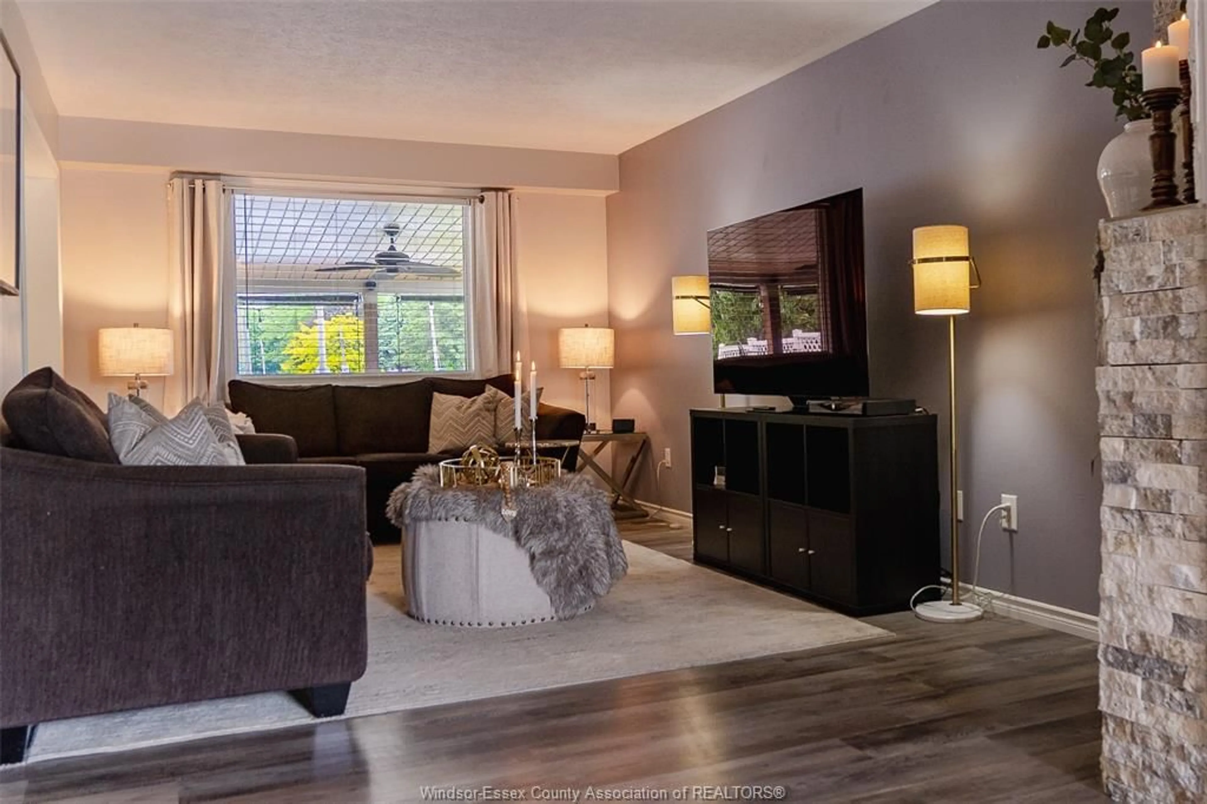 Living room with furniture, wood/laminate floor for 705 MICHAEL, Tecumseh Ontario N8N 5A2