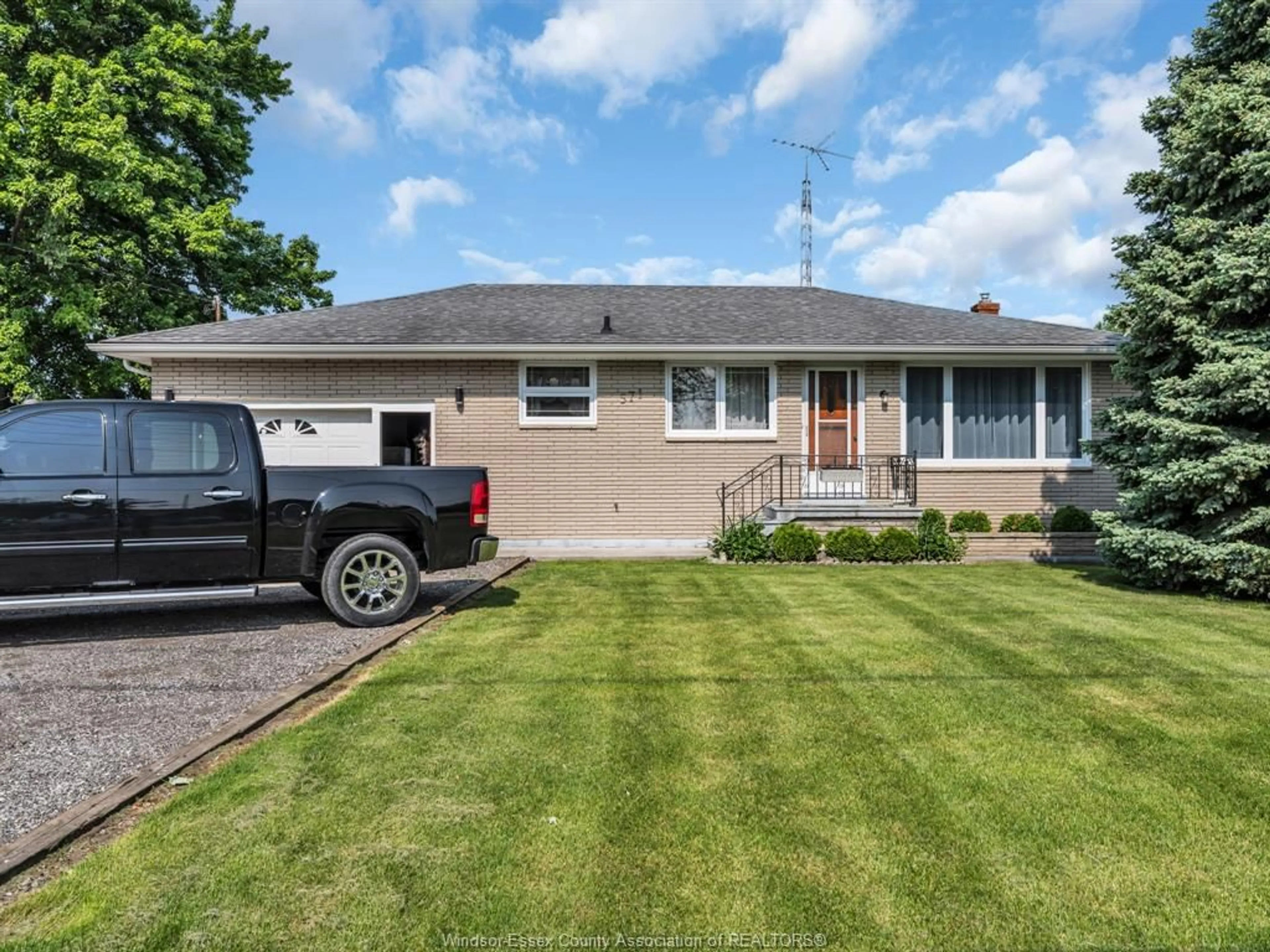 Home with vinyl exterior material, street for 571 Highway 77, Leamington Ontario N8H 3V8
