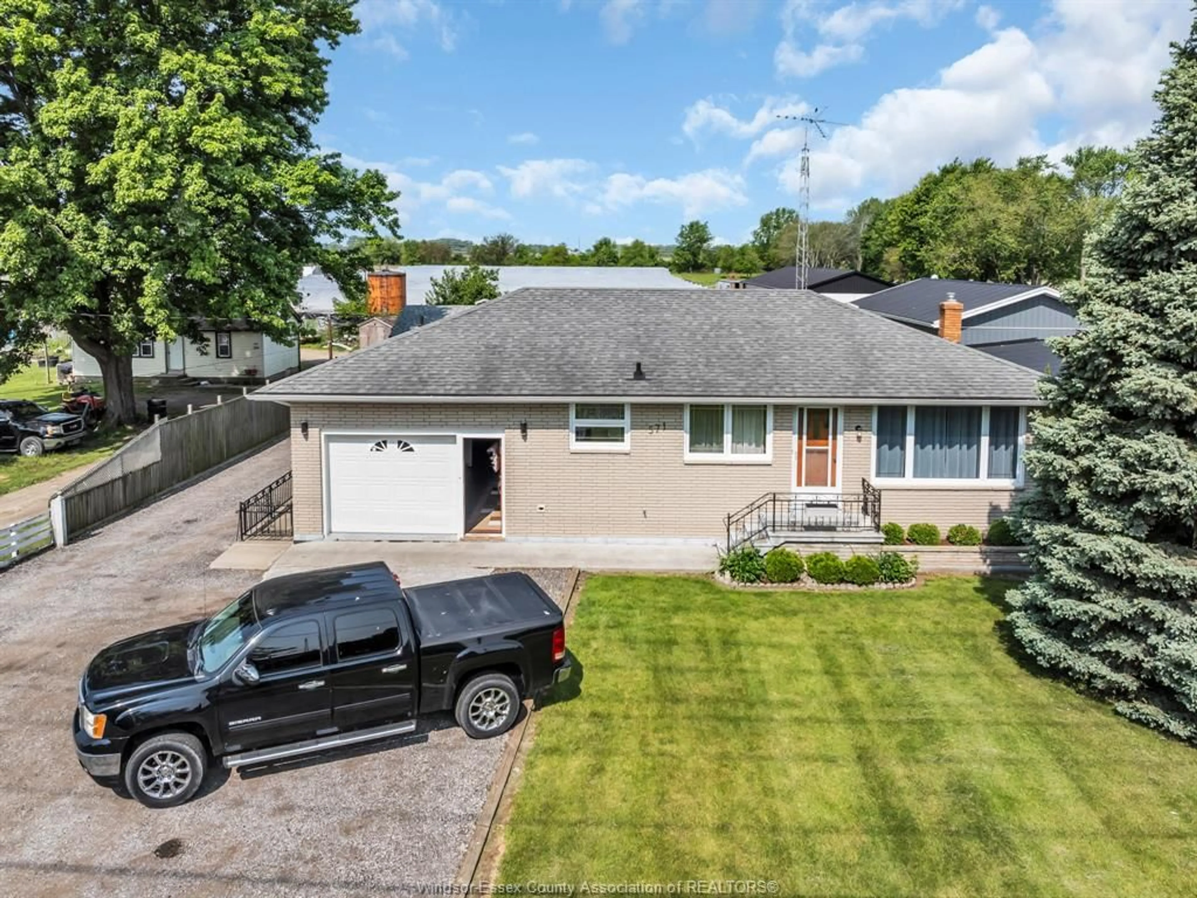A pic from outside/outdoor area/front of a property/back of a property/a pic from drone, street for 571 Highway 77, Leamington Ontario N8H 3V8