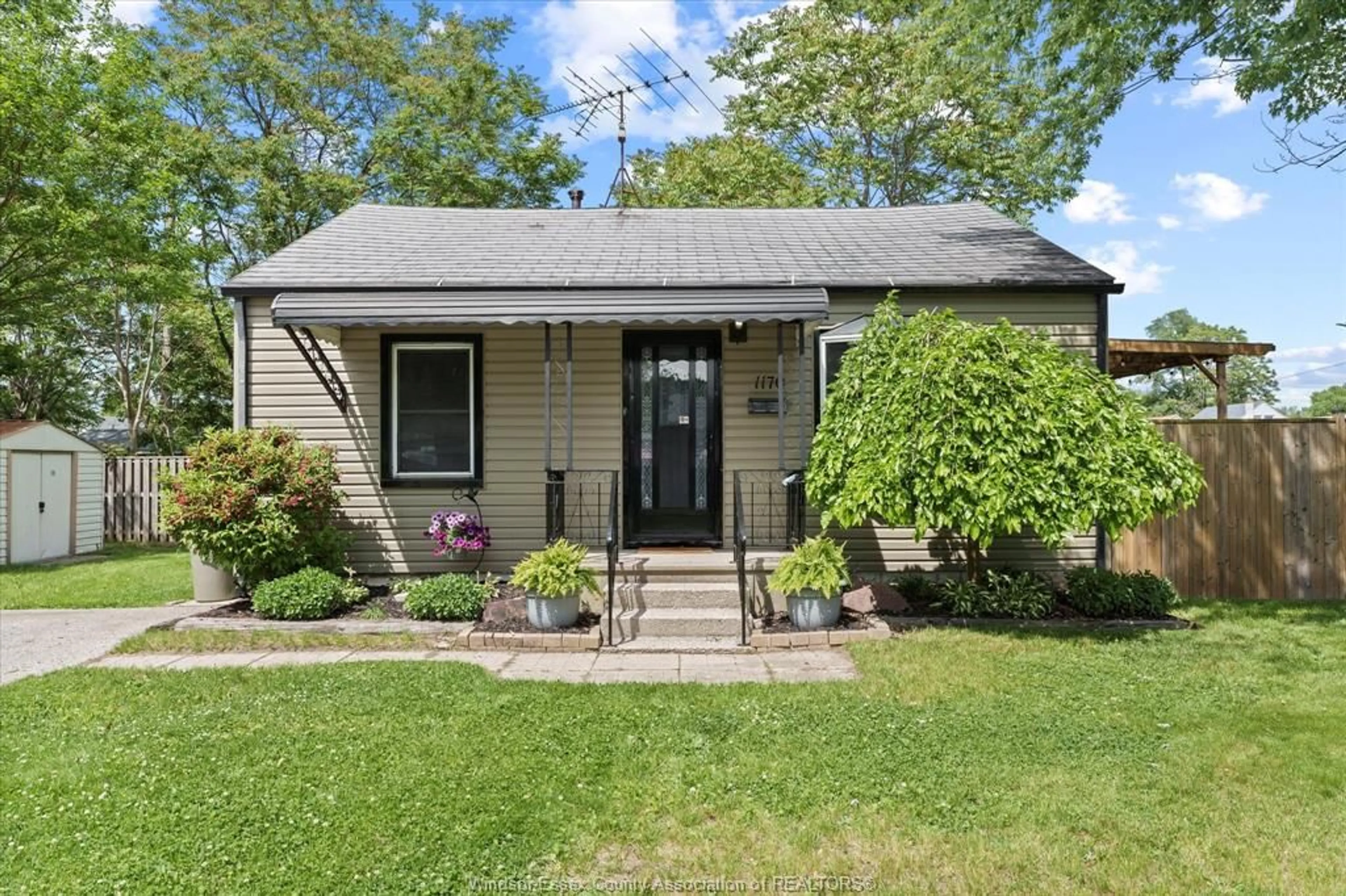 Home with vinyl exterior material, street for 1170 STRATHMORE Ave, Windsor Ontario N9C 3N5