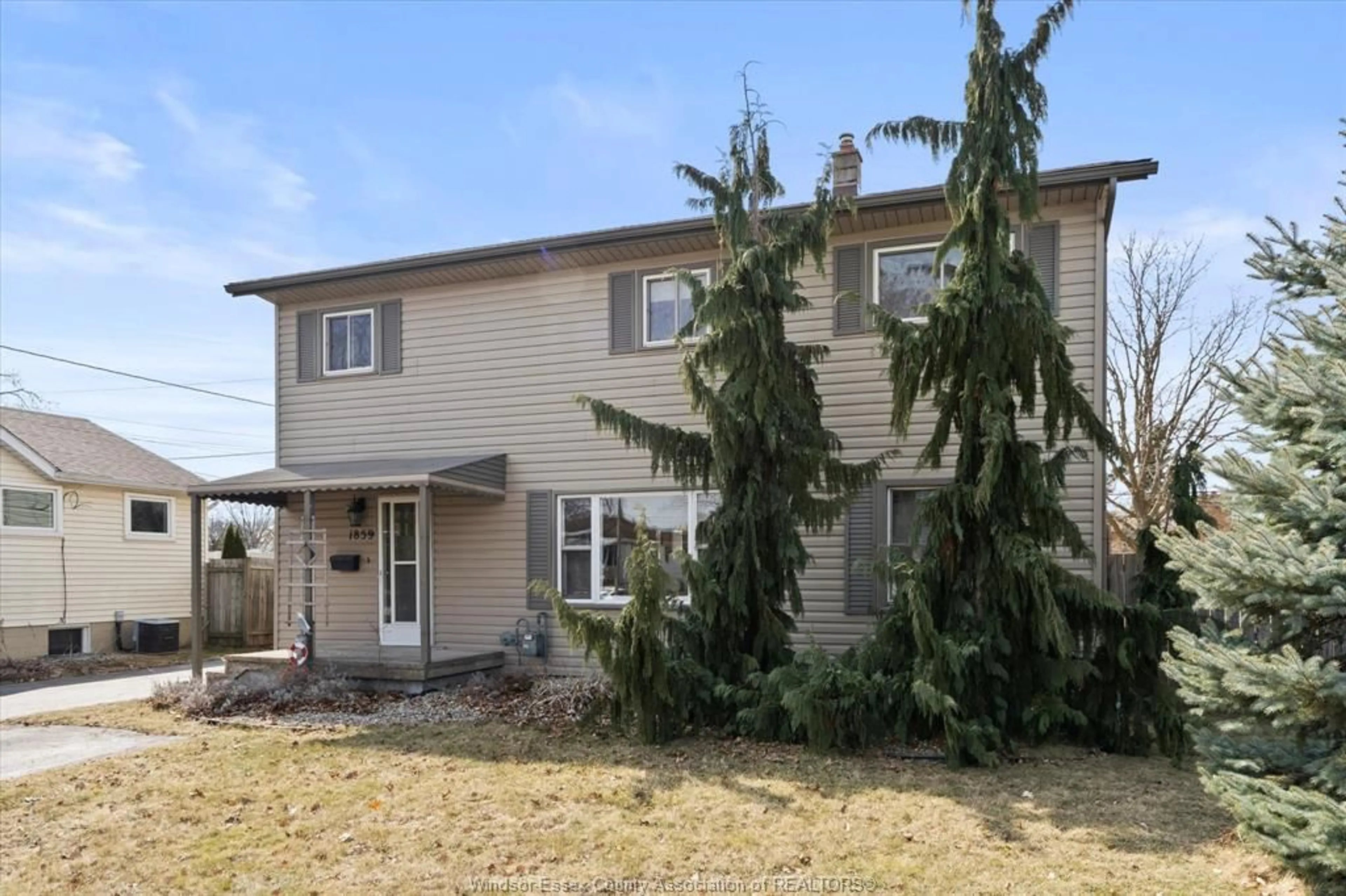 Home with vinyl exterior material, street for 1859 Ford, Windsor Ontario N8T 2E2