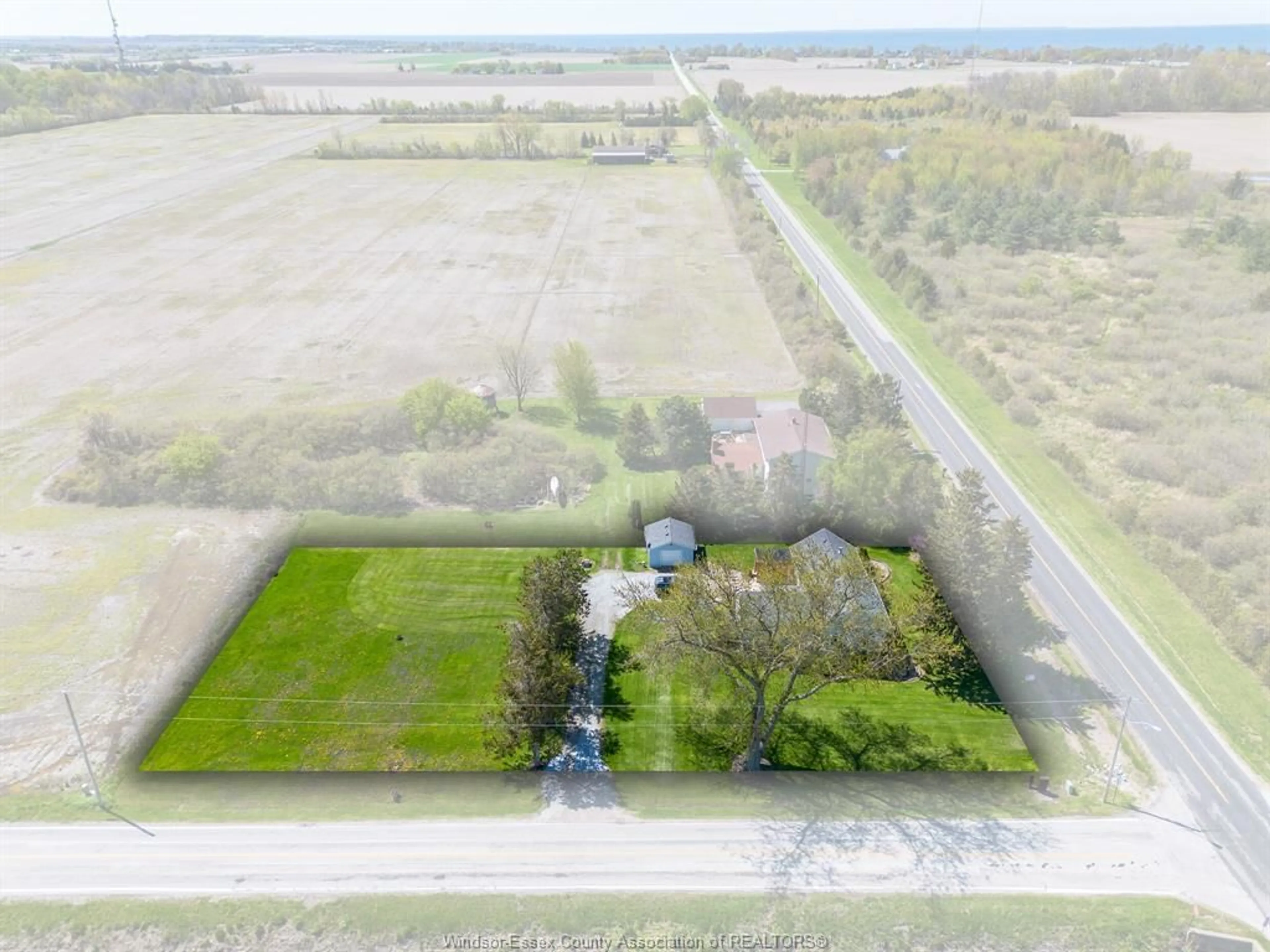 A pic from outside/outdoor area/front of a property/back of a property/a pic from drone, unknown for 1300 Mersea Road B, Leamington Ontario N8H 3V7
