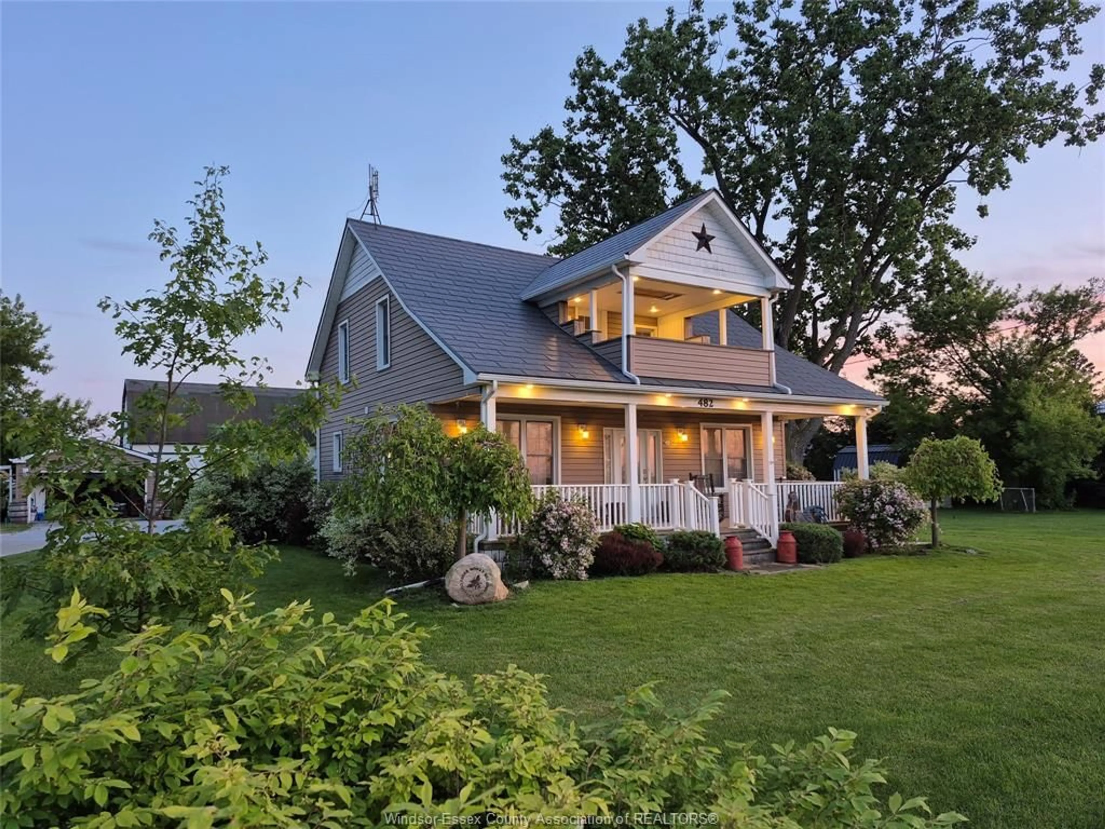 Home with vinyl exterior material, street for 482 COUNTY RD 8, Kingsville Ontario N0R 1V0
