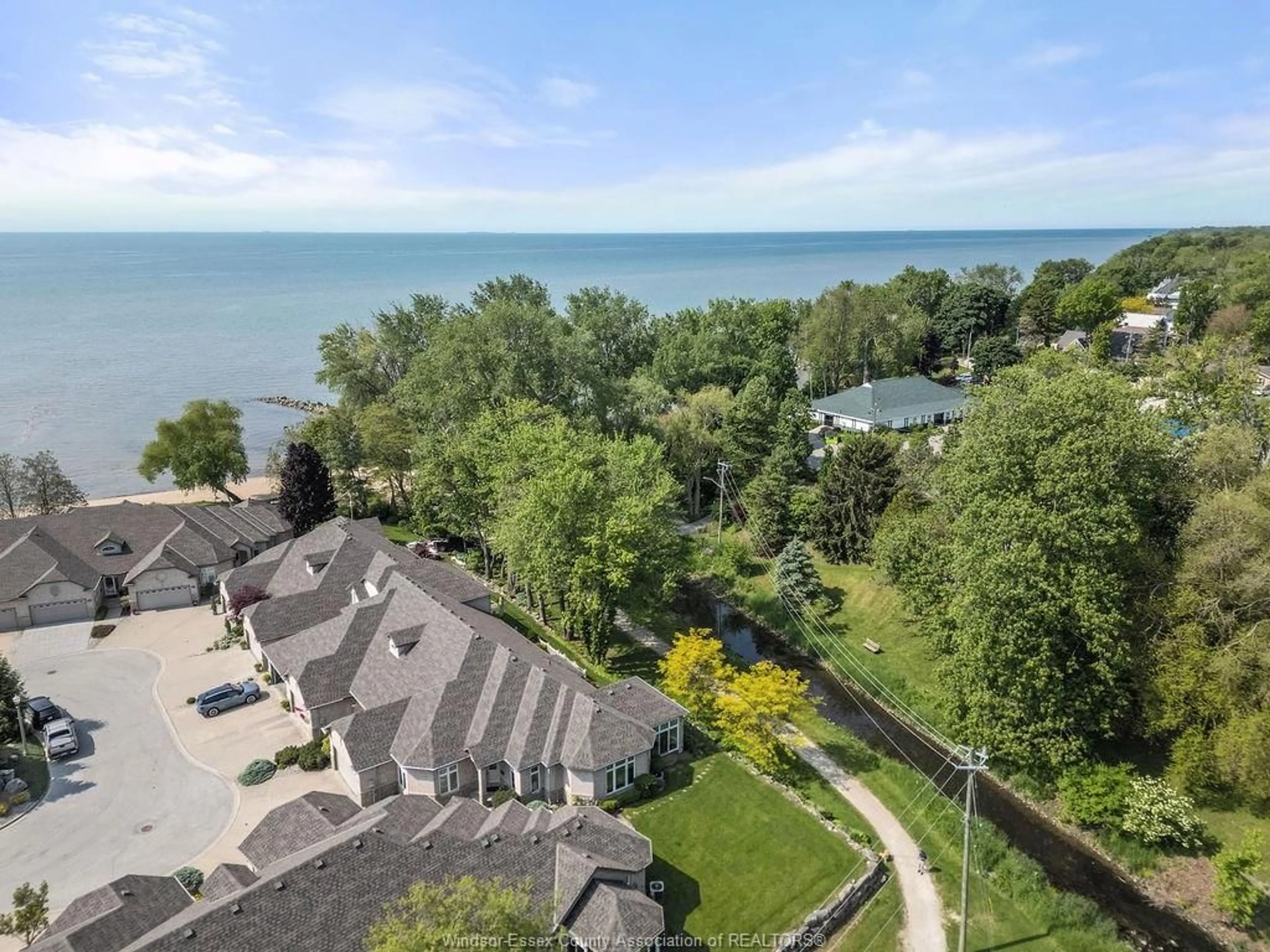 A pic from outside/outdoor area/front of a property/back of a property/a pic from drone, water/lake/river/ocean view for 16 LAKESIDE Cres, Kingsville Ontario N9Y 4C1