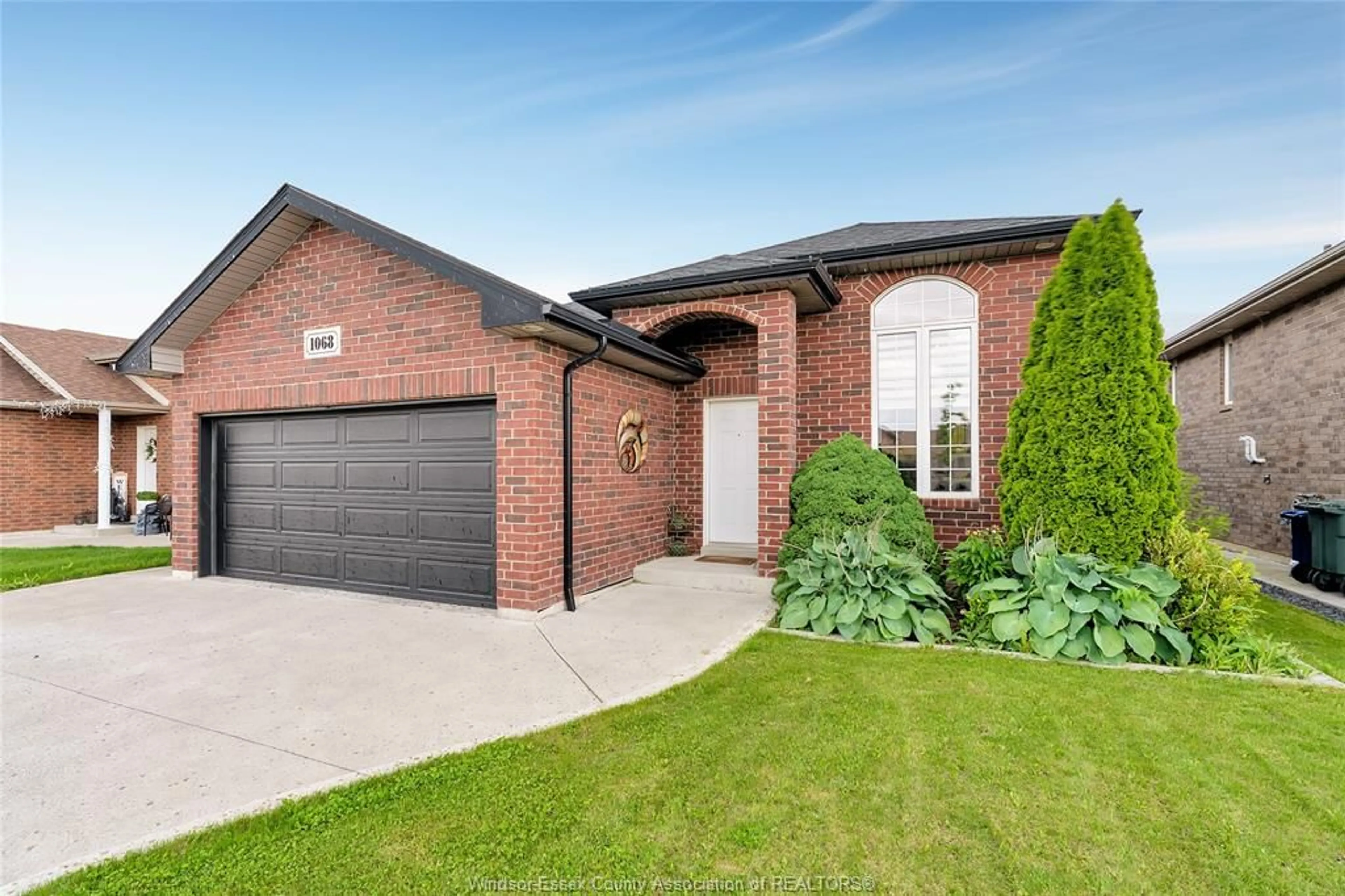 Home with brick exterior material, street for 1068 THUNDERBAY Ave, Windsor Ontario N8P 0C1