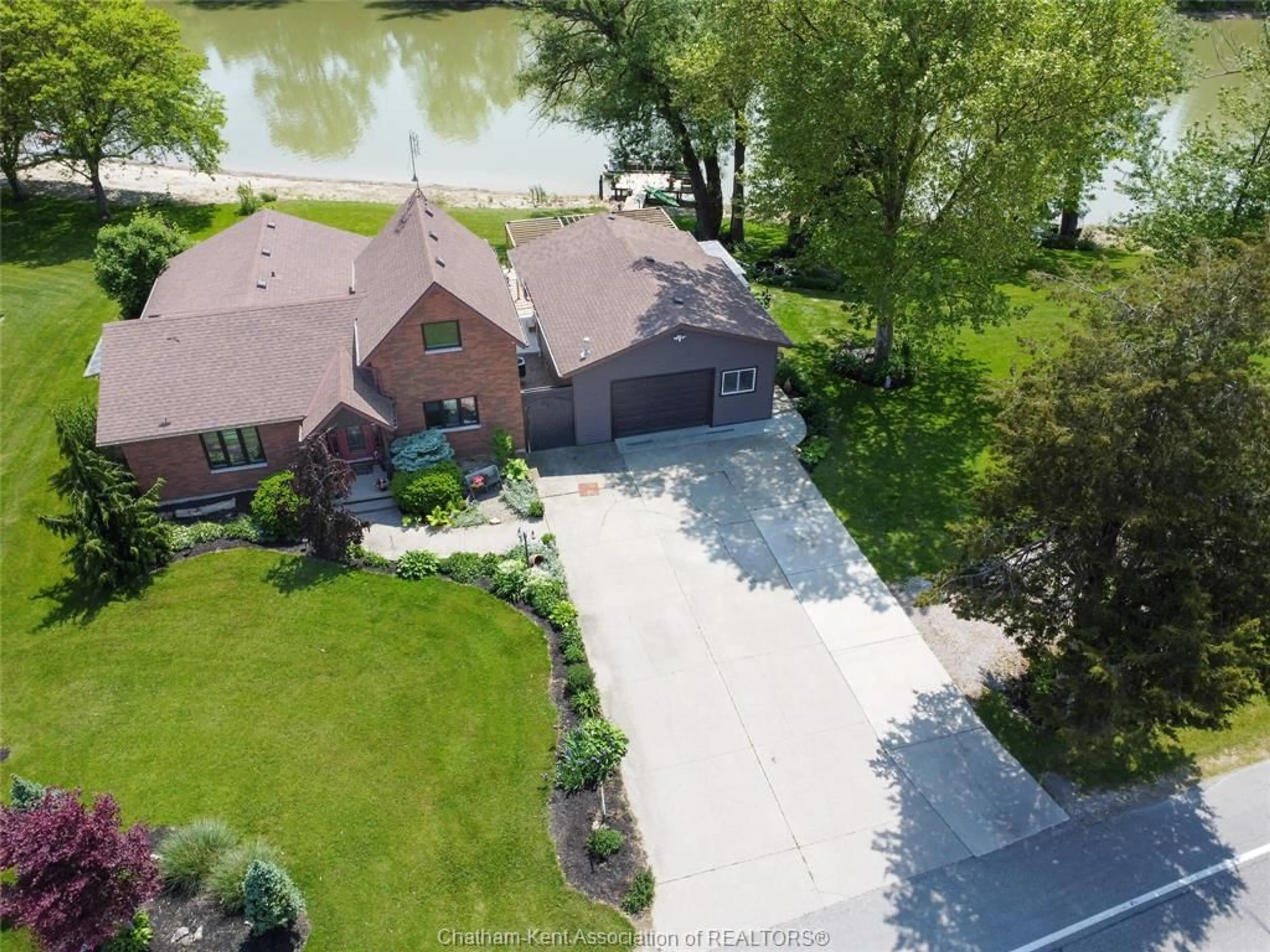 A pic from outside/outdoor area/front of a property/back of a property/a pic from drone, water/lake/river/ocean view for 7690 Grande River Line, Chatham-Kent Ontario N7M 5J7