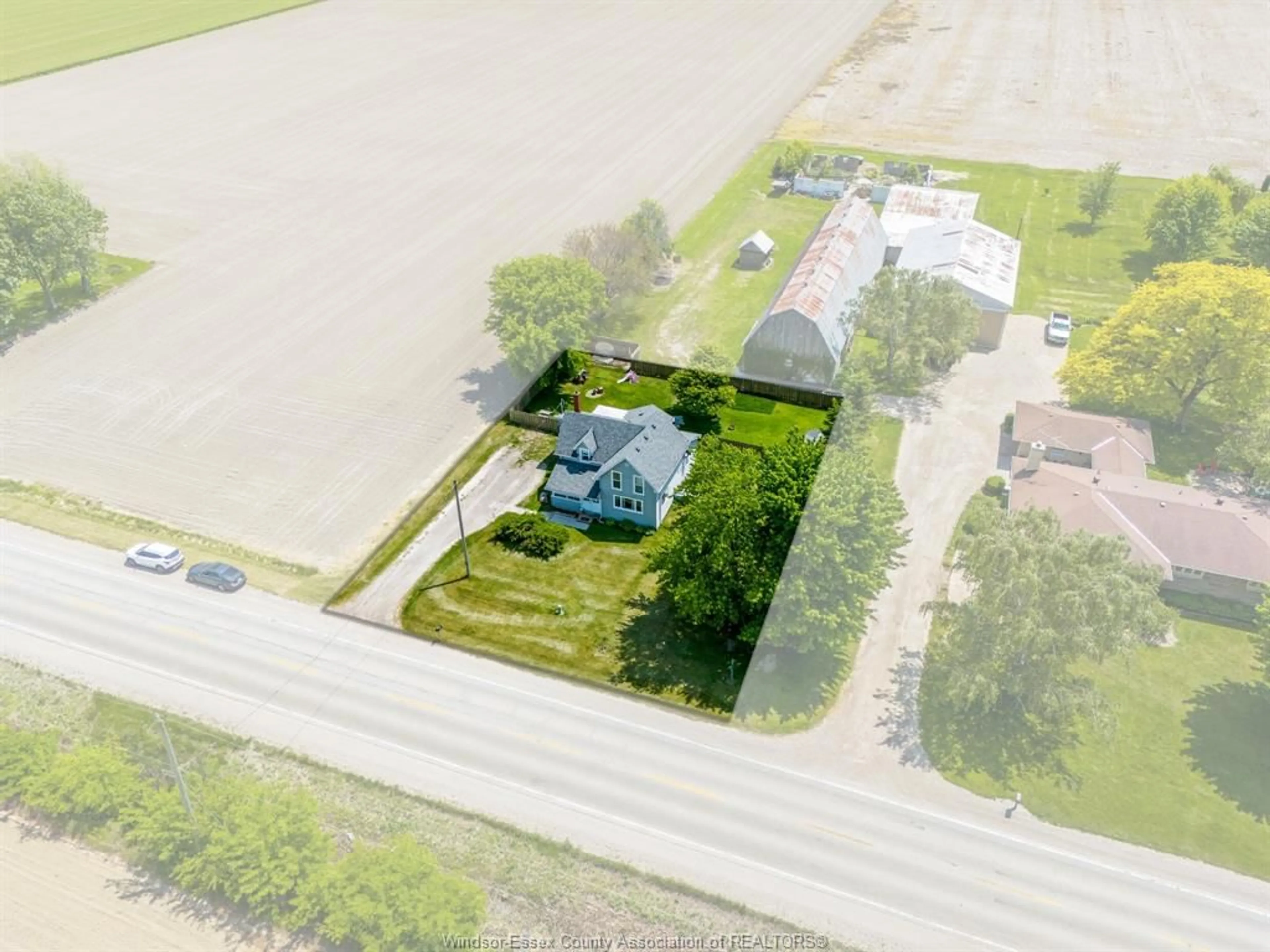 A pic from outside/outdoor area/front of a property/back of a property/a pic from drone, street for 691 ROAD 4, Kingsville Ontario N9Y 2E5