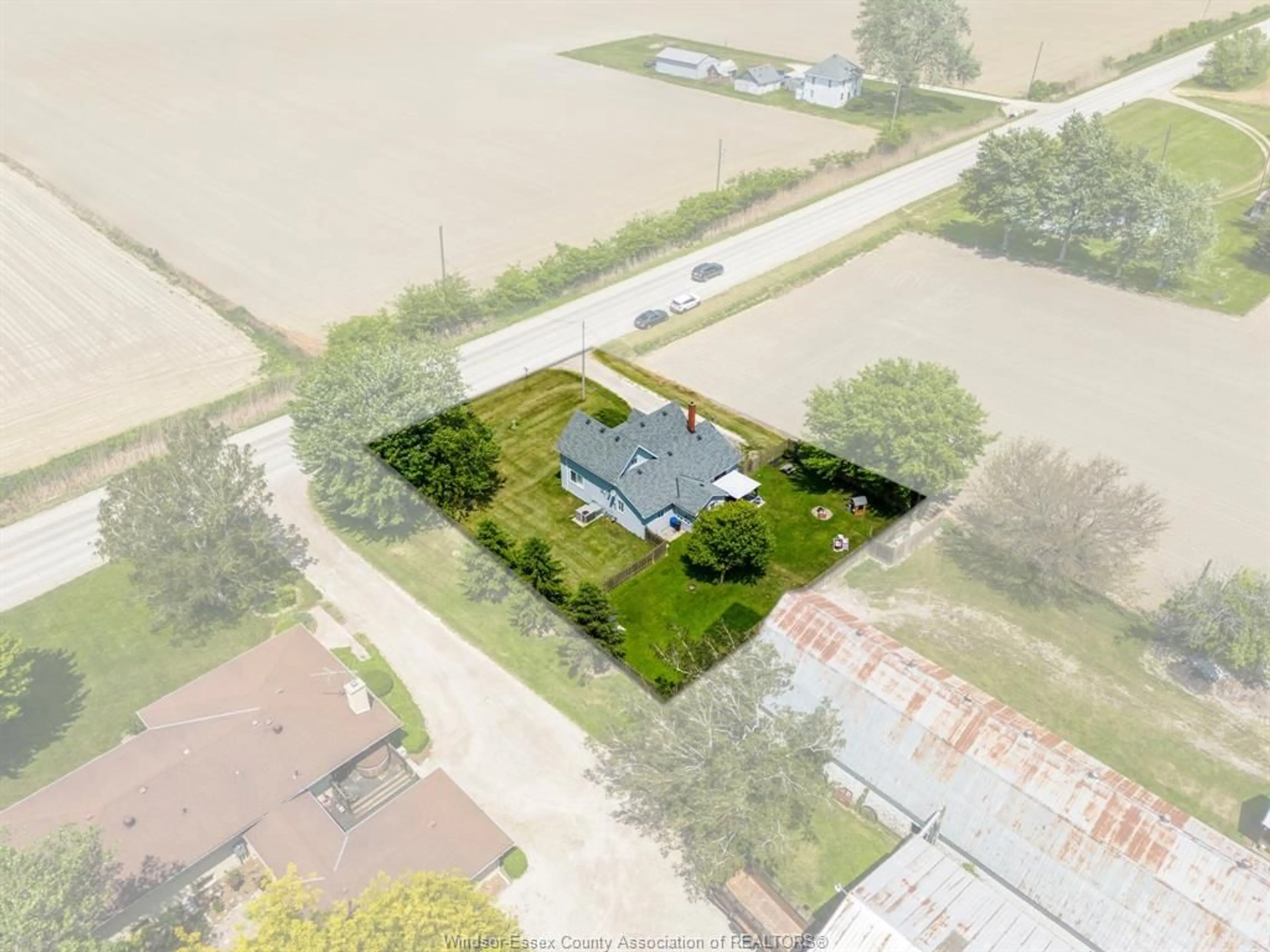 A pic from outside/outdoor area/front of a property/back of a property/a pic from drone, street for 691 ROAD 4, Kingsville Ontario N9Y 2E5