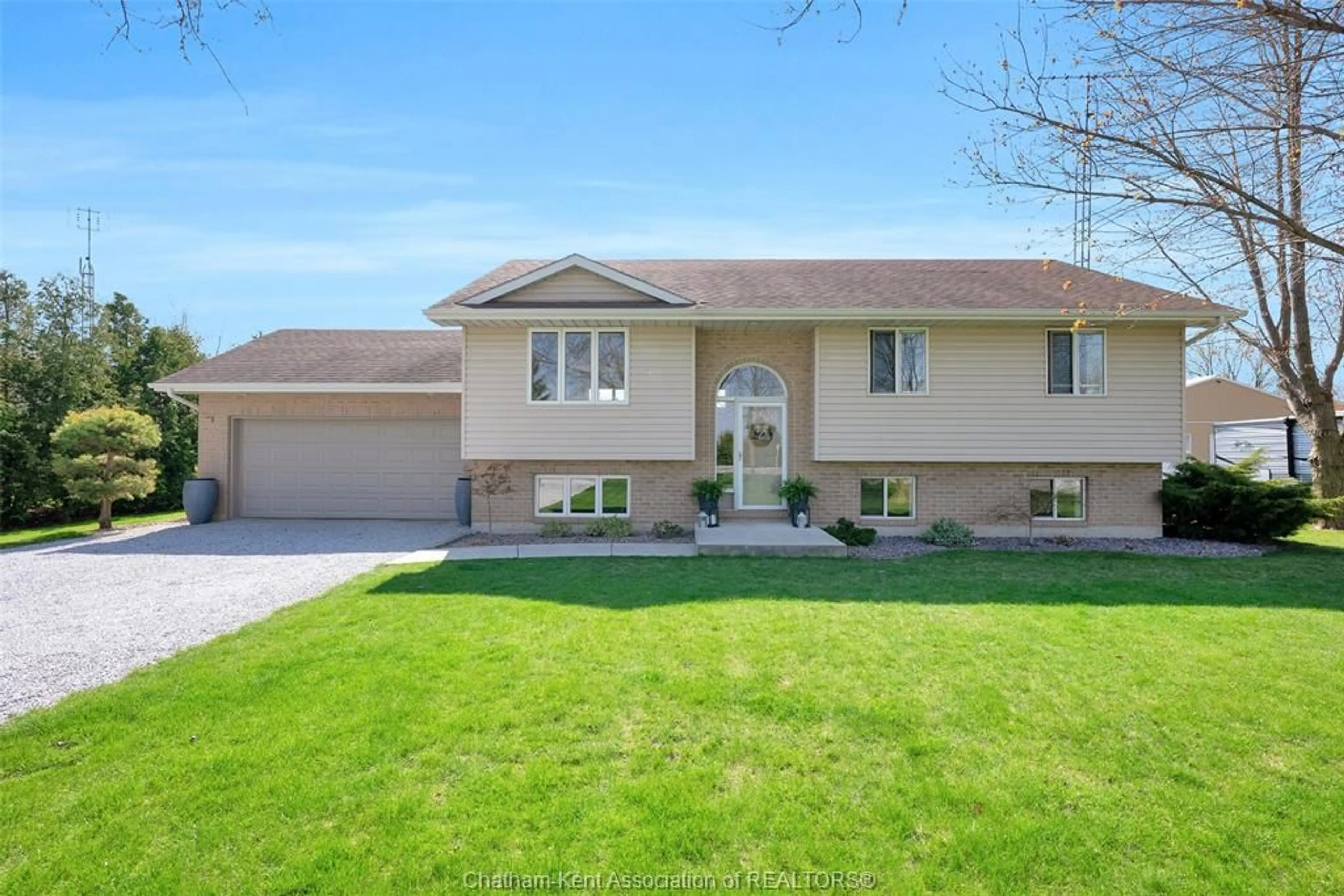 Home with vinyl exterior material, street for 7110 Pain Court Line, Chatham-Kent Ontario N0P 1Z0