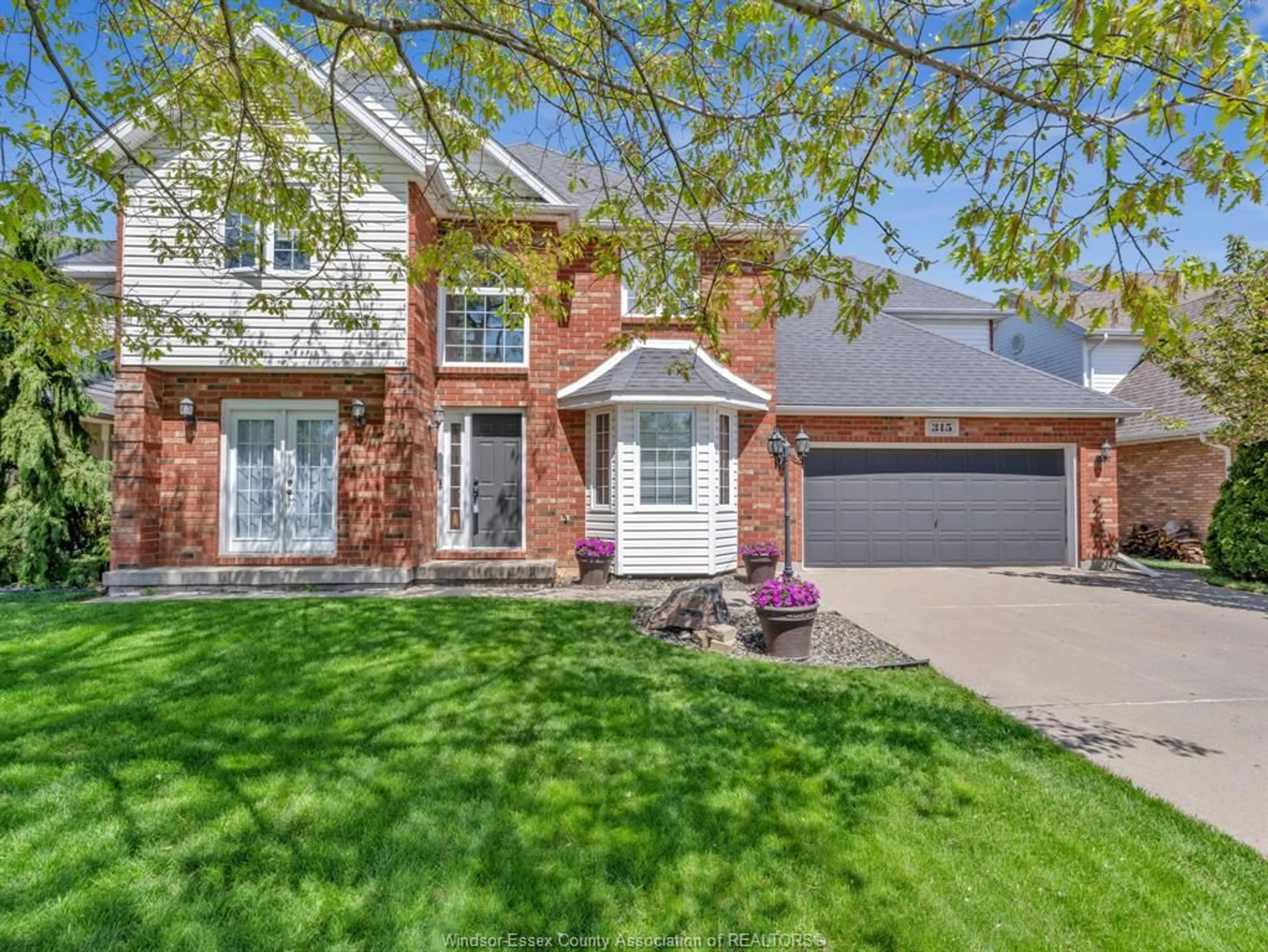 Home with brick exterior material, street for 315 MILLBROOK Dr, Kingsville Ontario N9Y 4A5