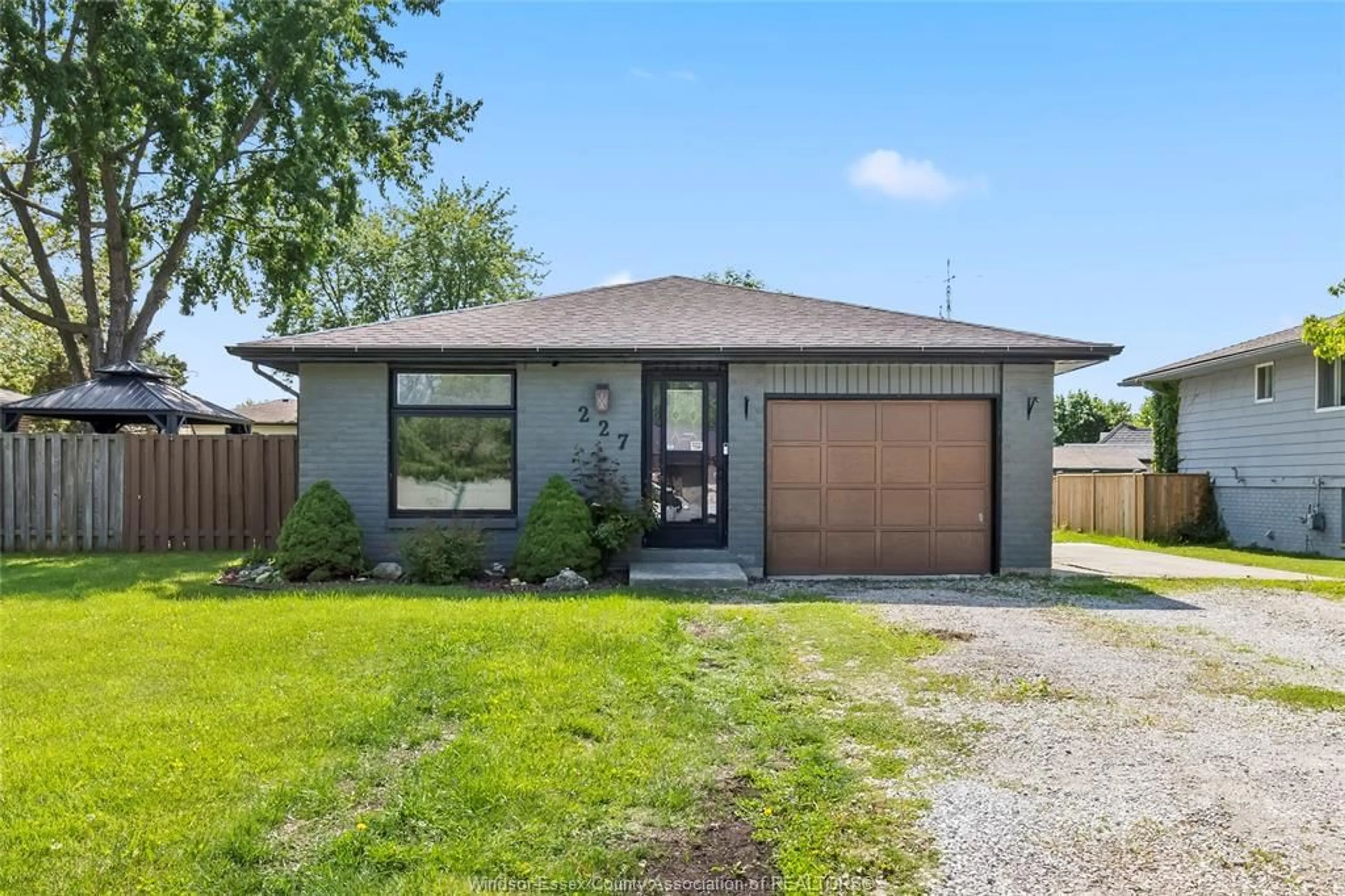 Home with brick exterior material, street for 227 WILLOWWOOD, Lakeshore Ontario N0R 1A0
