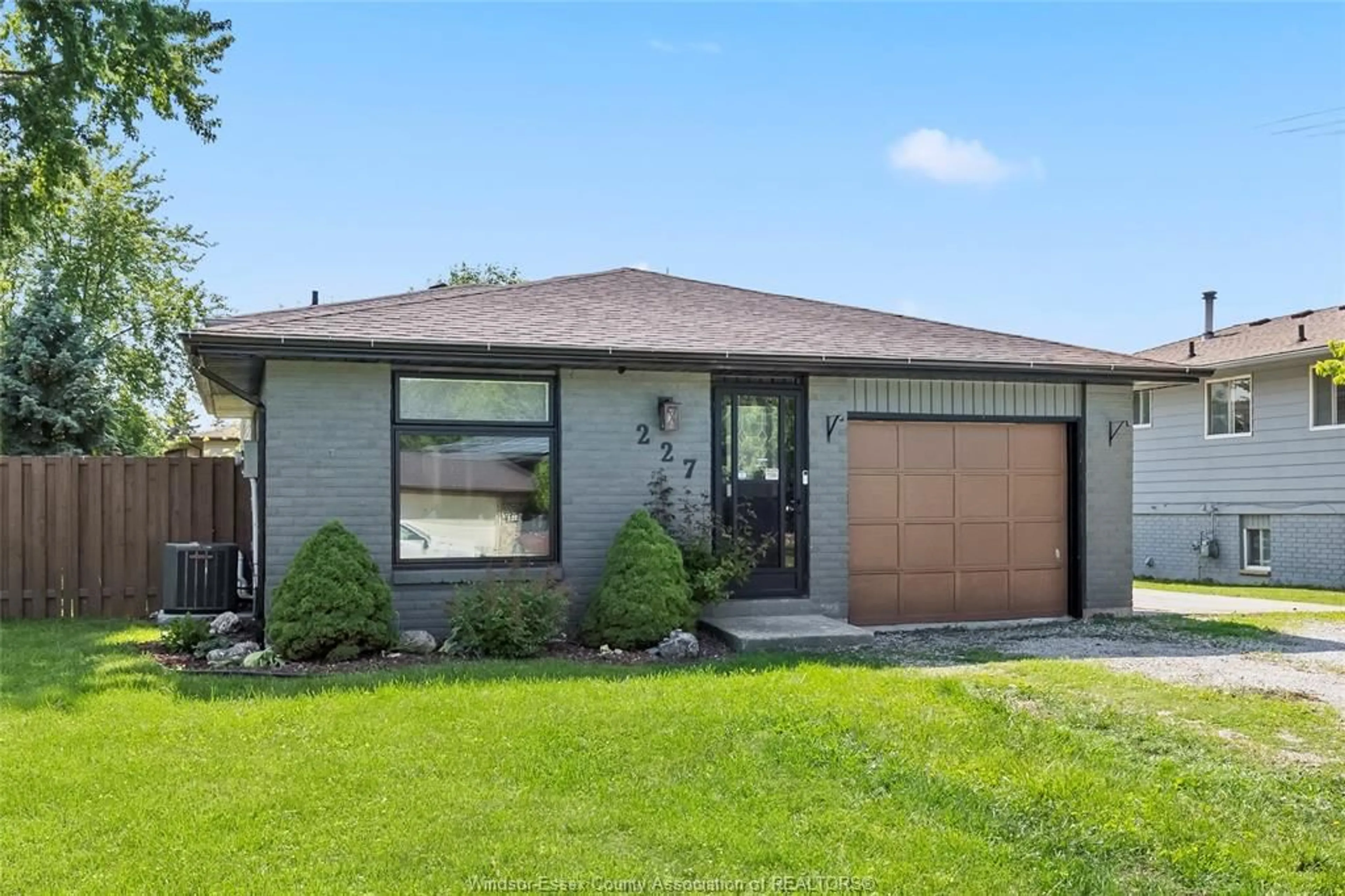 Home with brick exterior material, street for 227 WILLOWWOOD, Lakeshore Ontario N0R 1A0