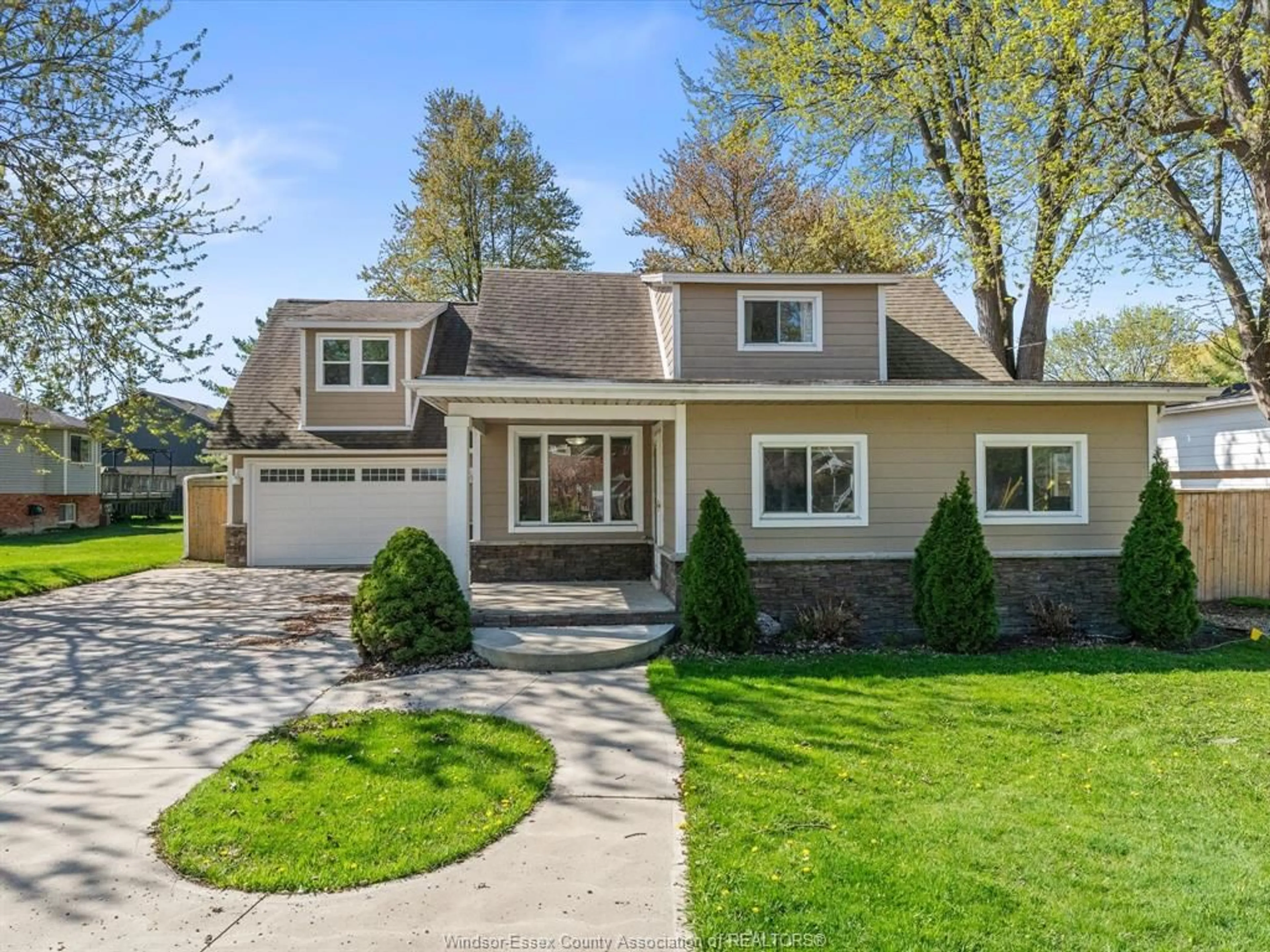 Home with vinyl exterior material, street for 553 OLD TECUMSEH Rd, Lakeshore Ontario N0R 1A0