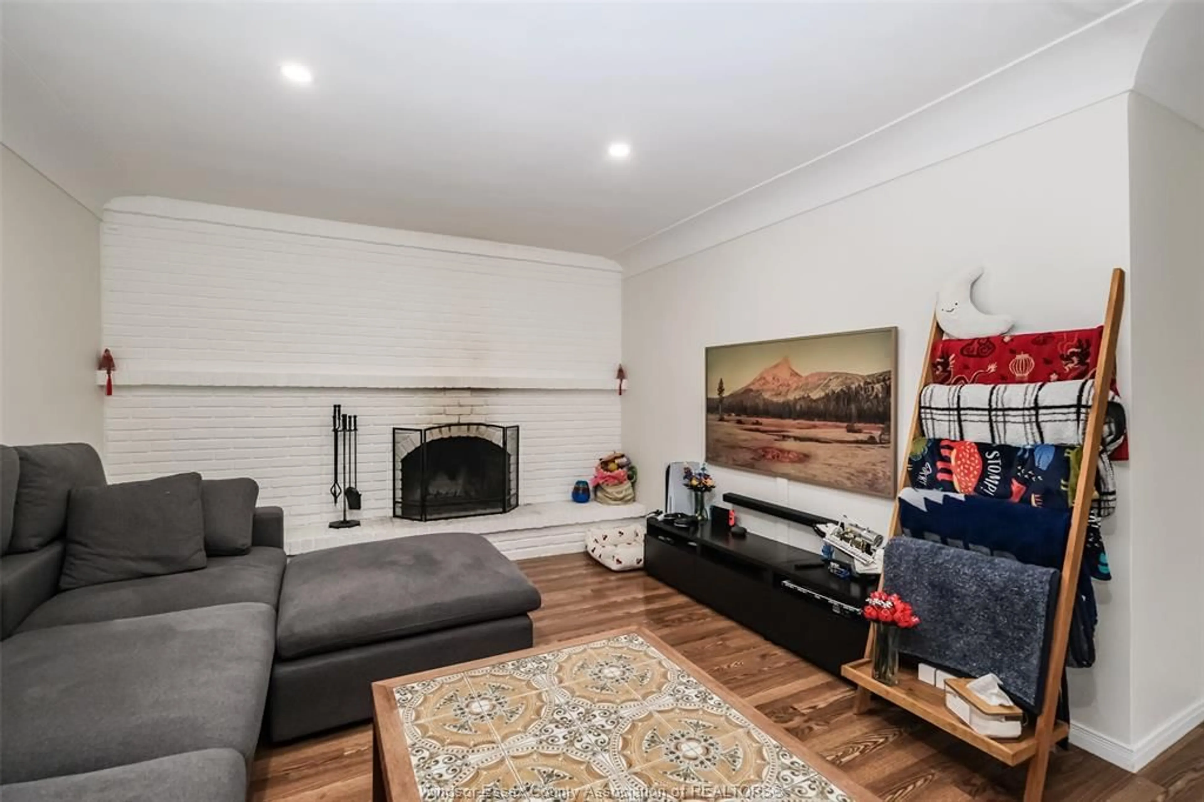Living room with furniture, wood/laminate floor for 7875 ST. ROSE, Windsor Ontario N8S 1Z2